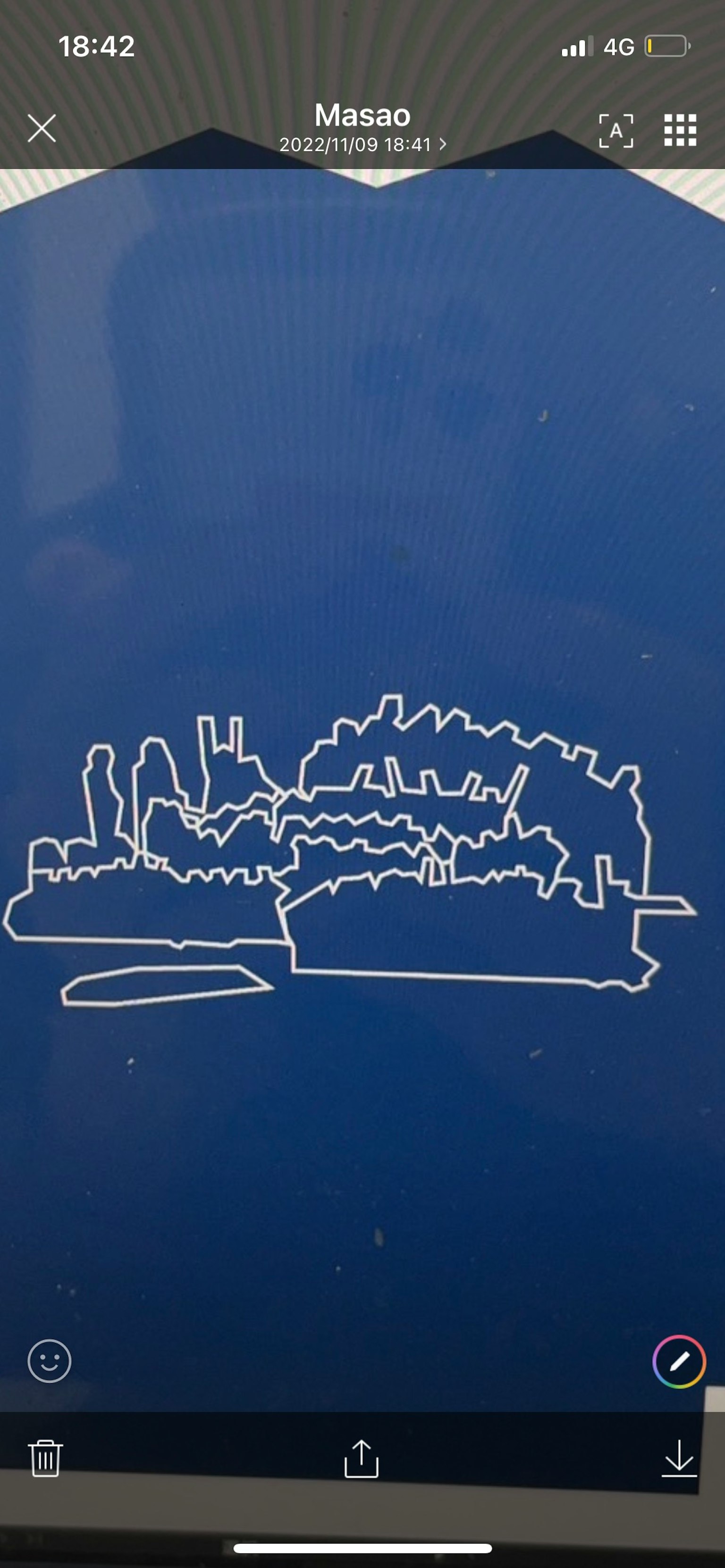 Silhouette of an island and buildings drawn in white lines on a blue background