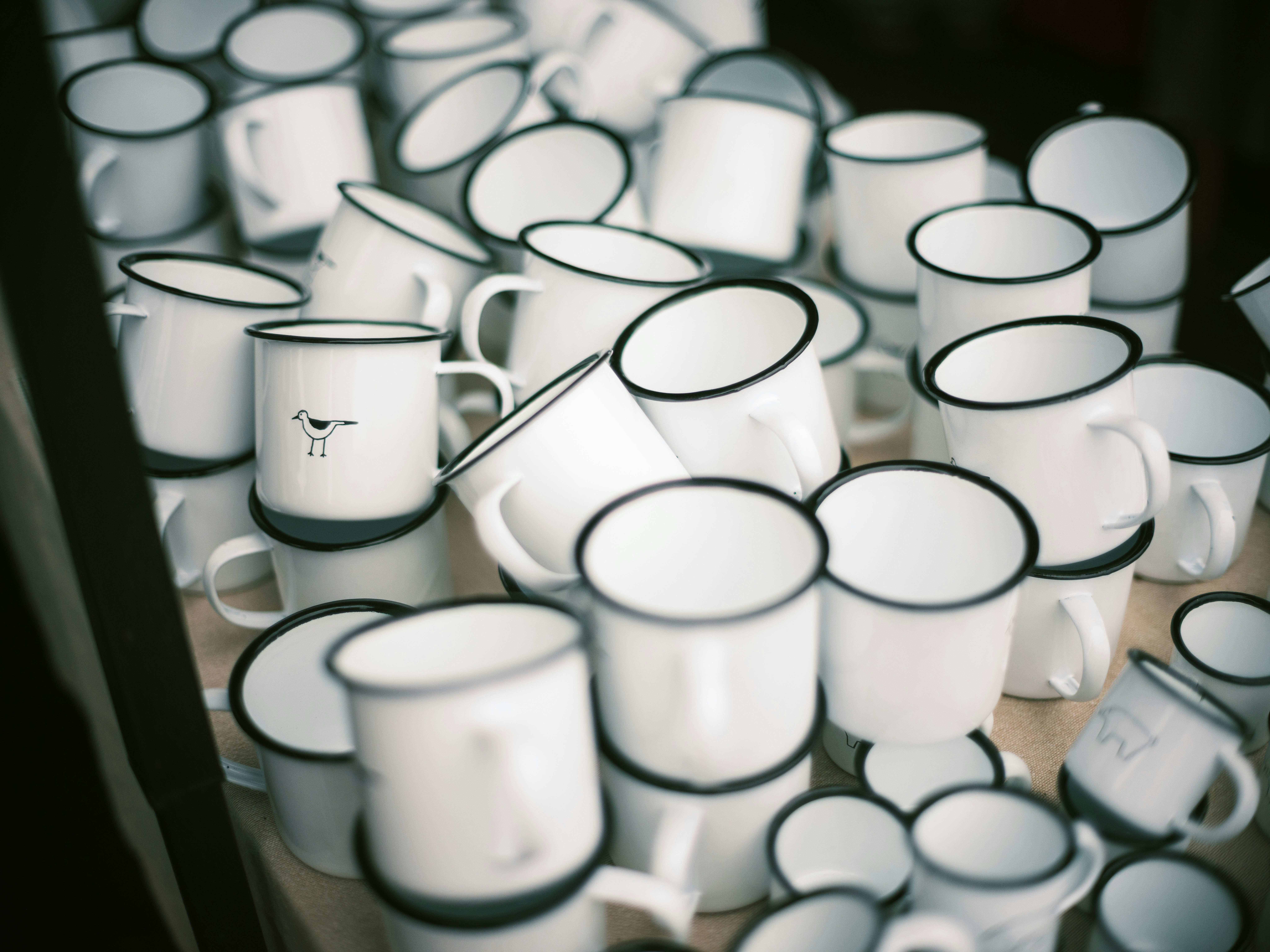 heap of white mugs at a flea market