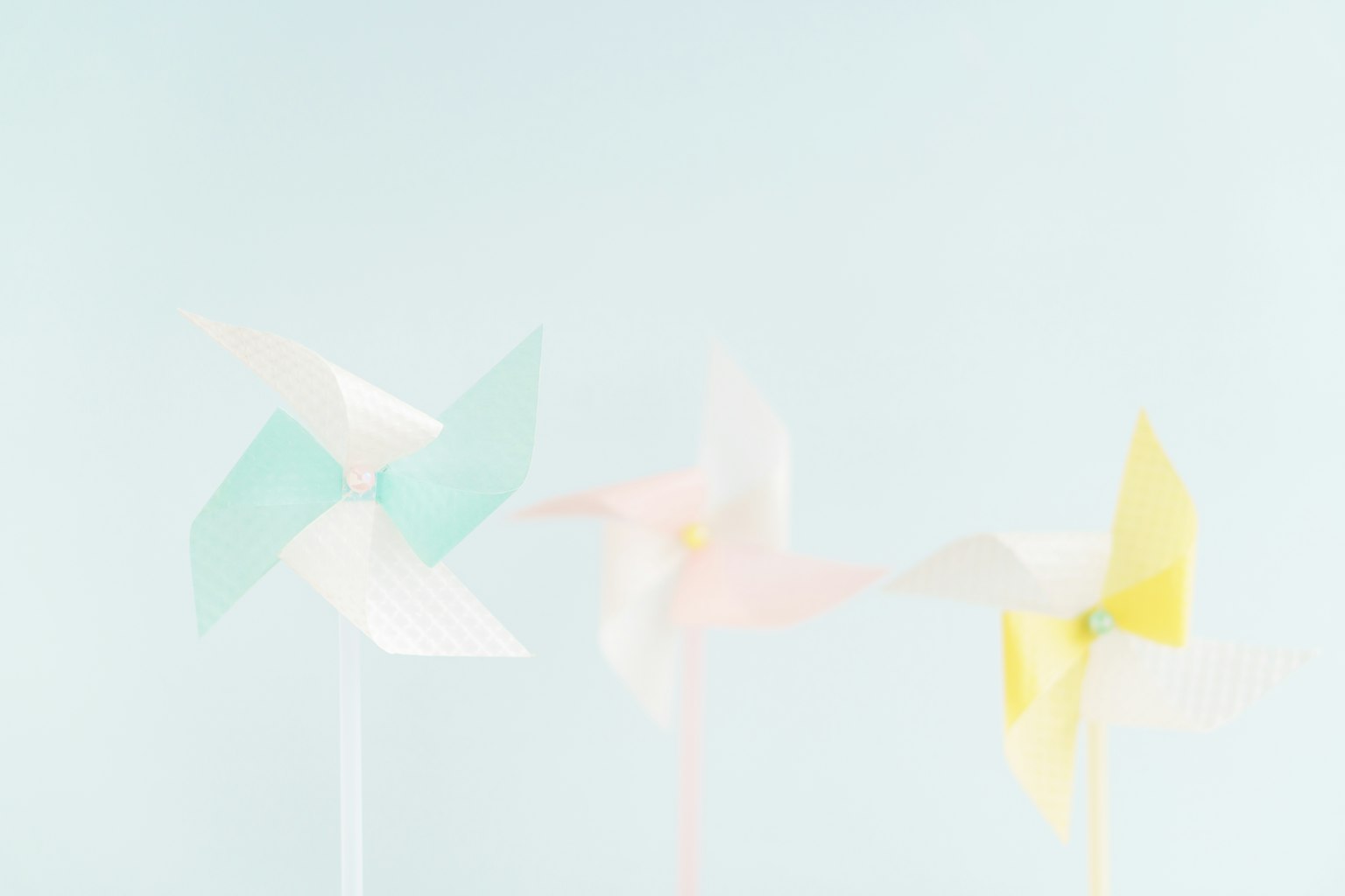 Colorful pinwheels on a light background