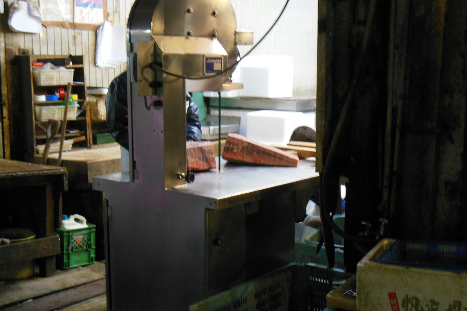 Meat cutting machine in a workshop with wooden surroundings