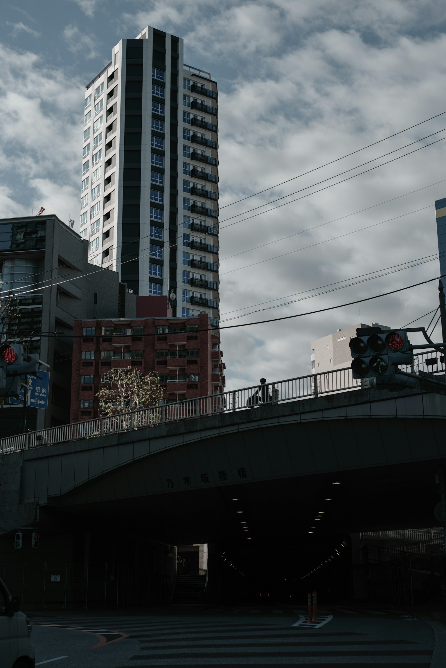 Urban landscape featuring a high-rise building and a bridge