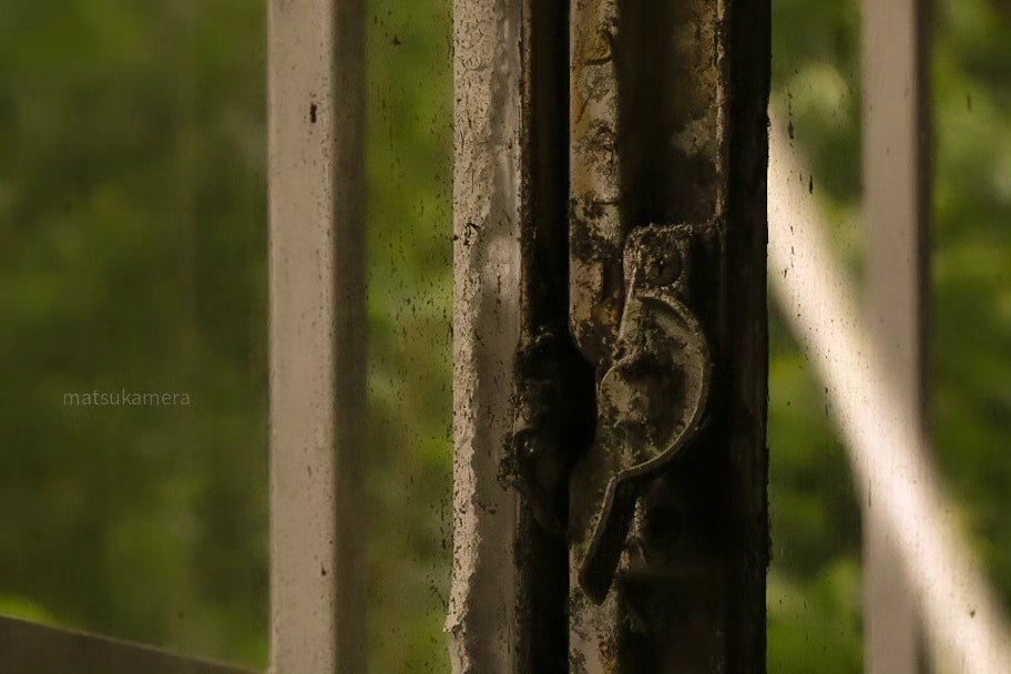 an old window latch on a sealed window
