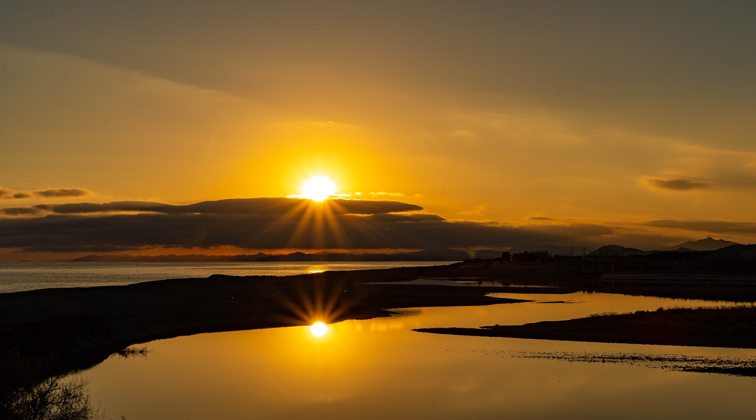Beautiful landscape with sunset reflecting on the water