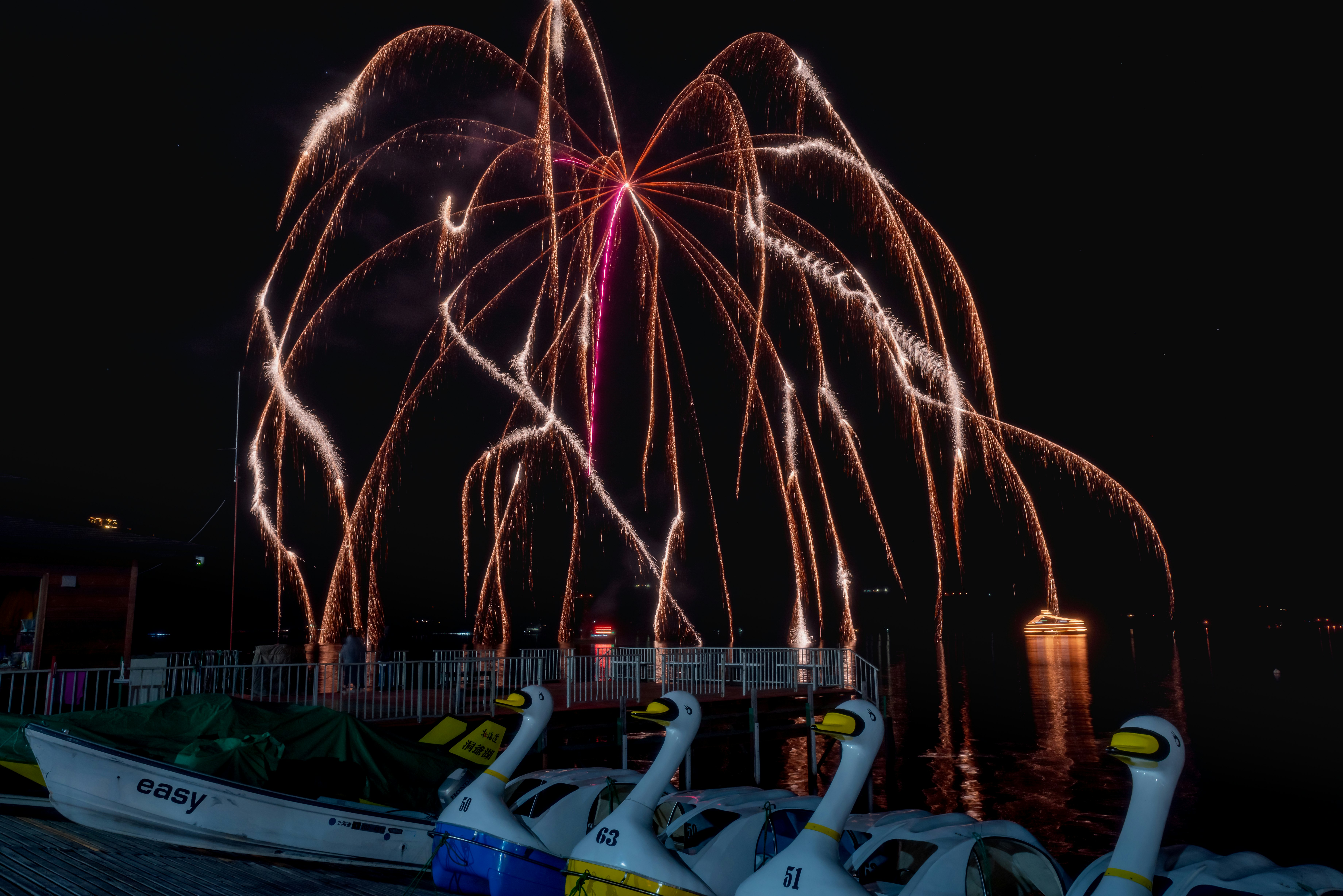 Fireworks over Lake Toya with lightning-like sparks