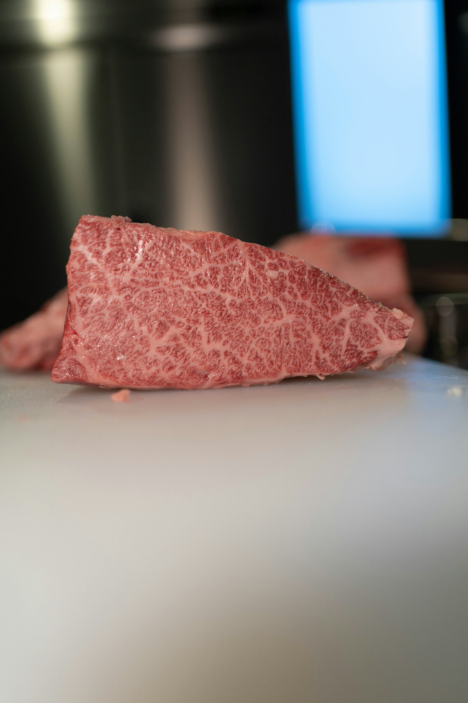 Close-up of marbled Wagyu beef on a cutting board