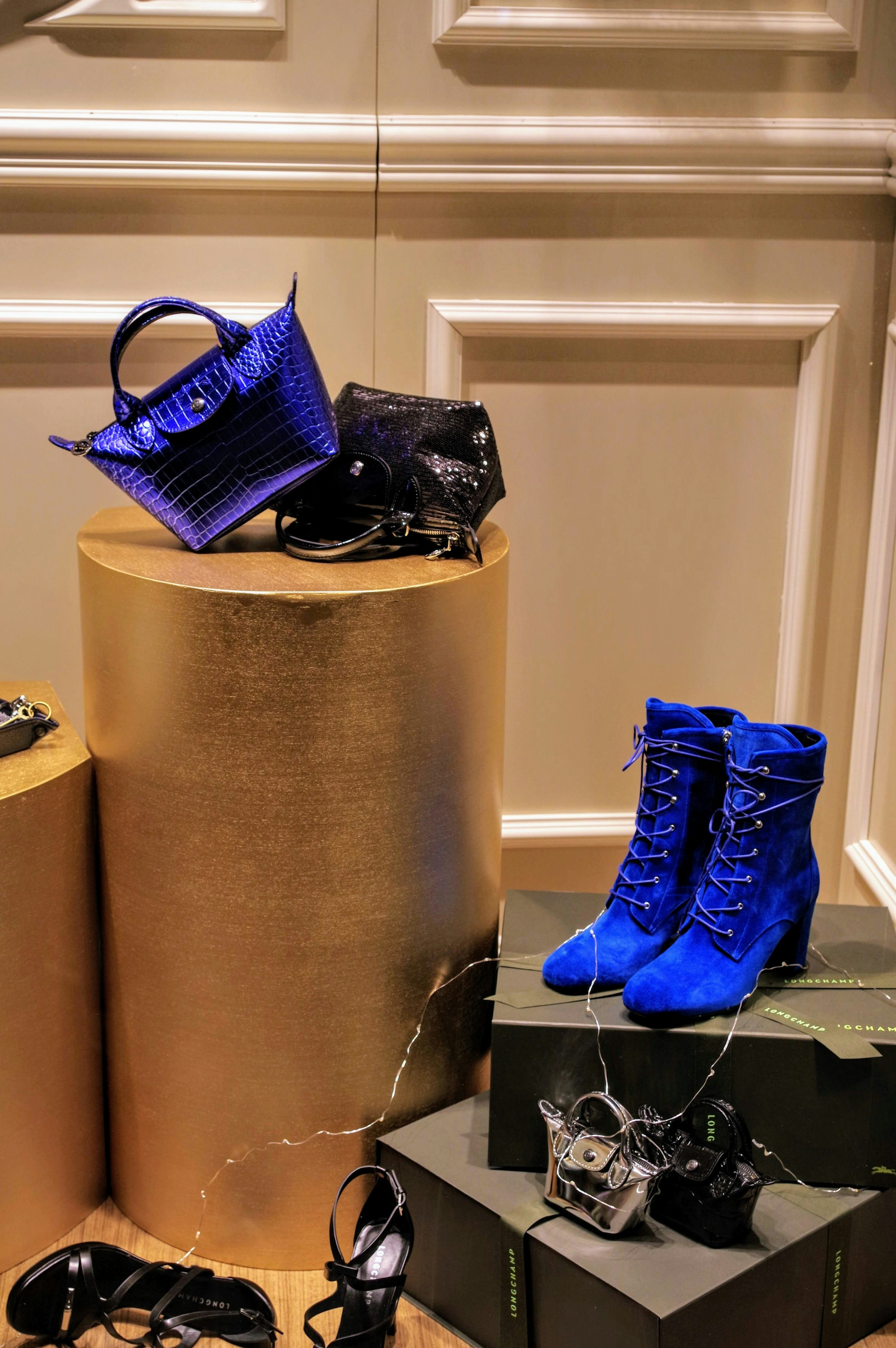 shoe and bag display in a shop window