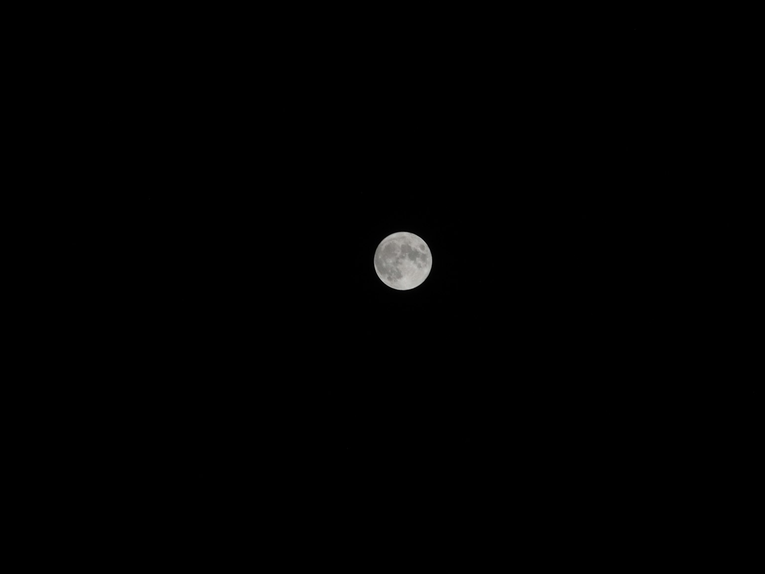 Bright full moon against a dark background