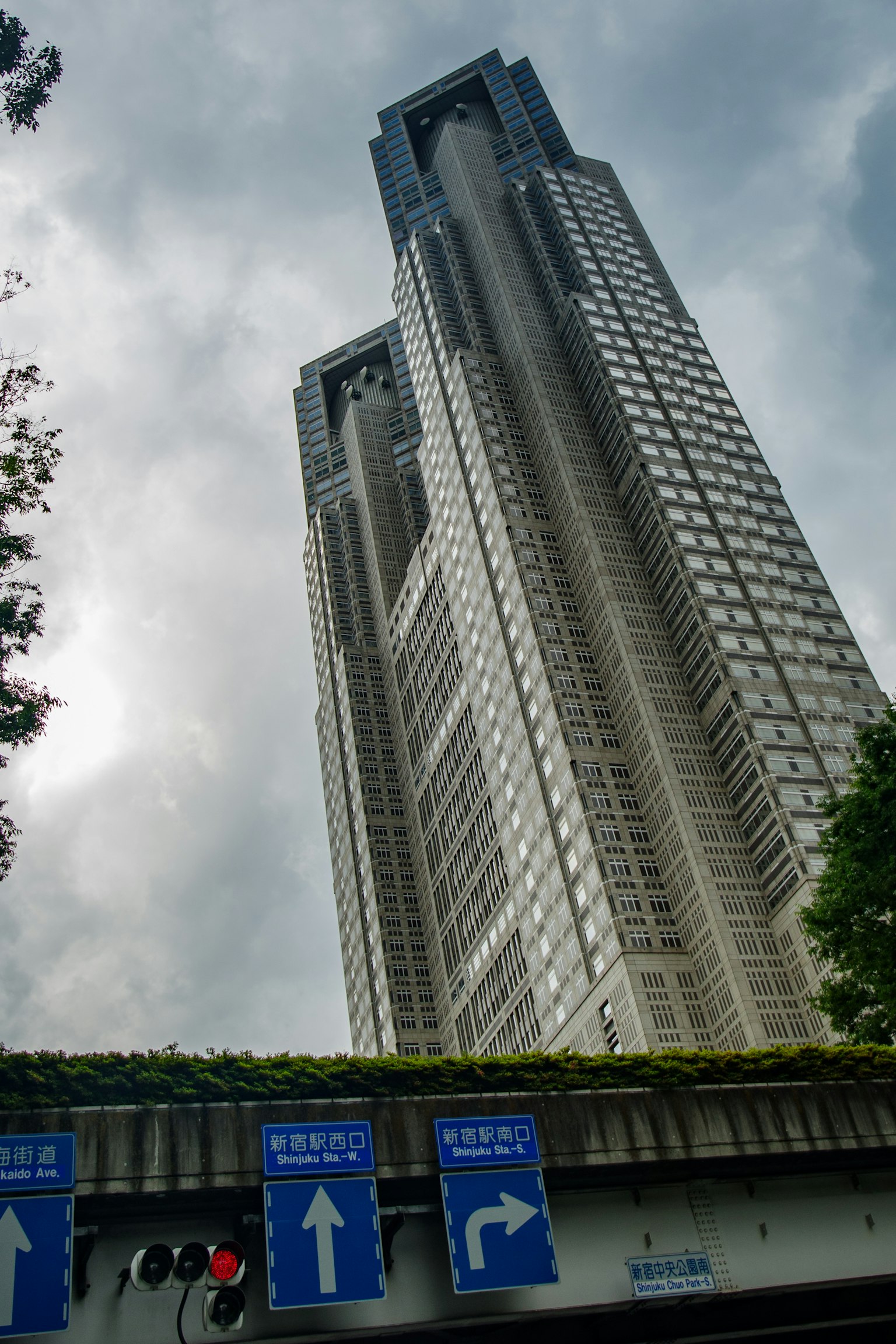 Tokyo Metropolitan Government Building towering under a cloudy sky