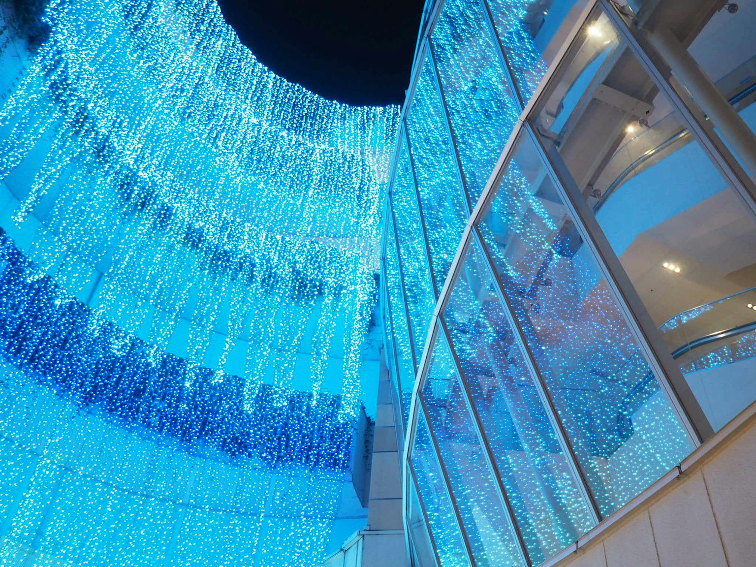 Building exterior adorned with blue lights Night view