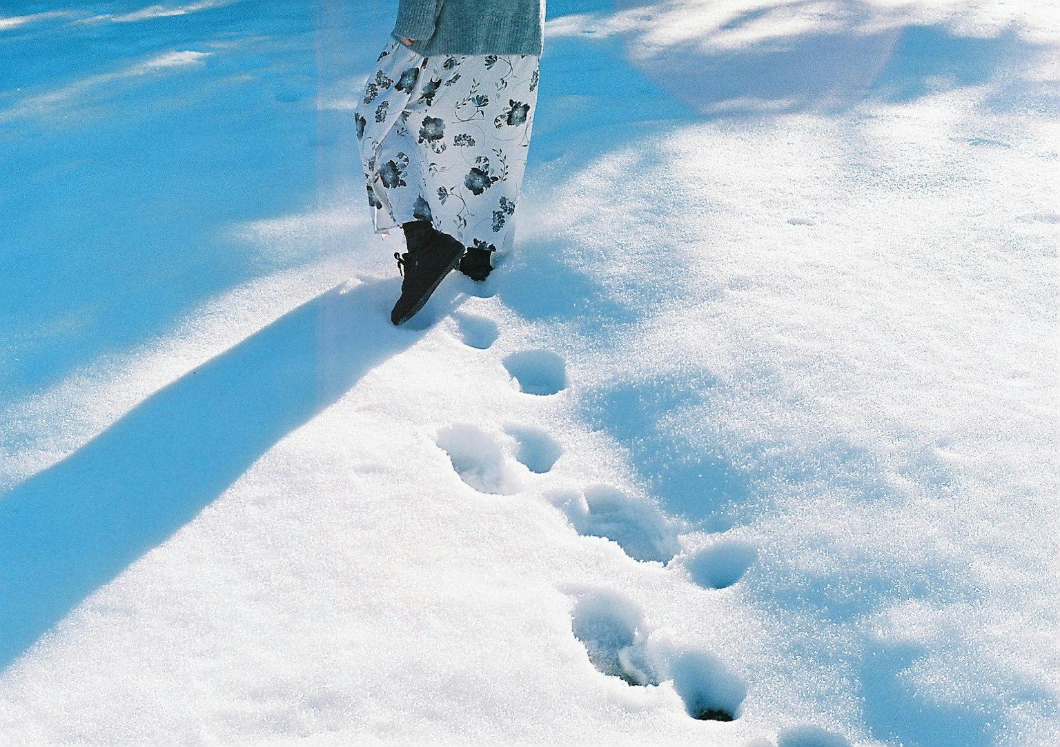 Woman's skirt leaving footprints in the snow