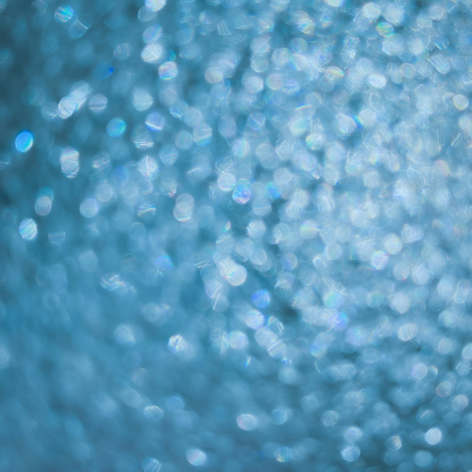 Fond bleu flou avec des points de lumière scintillants éparpillés