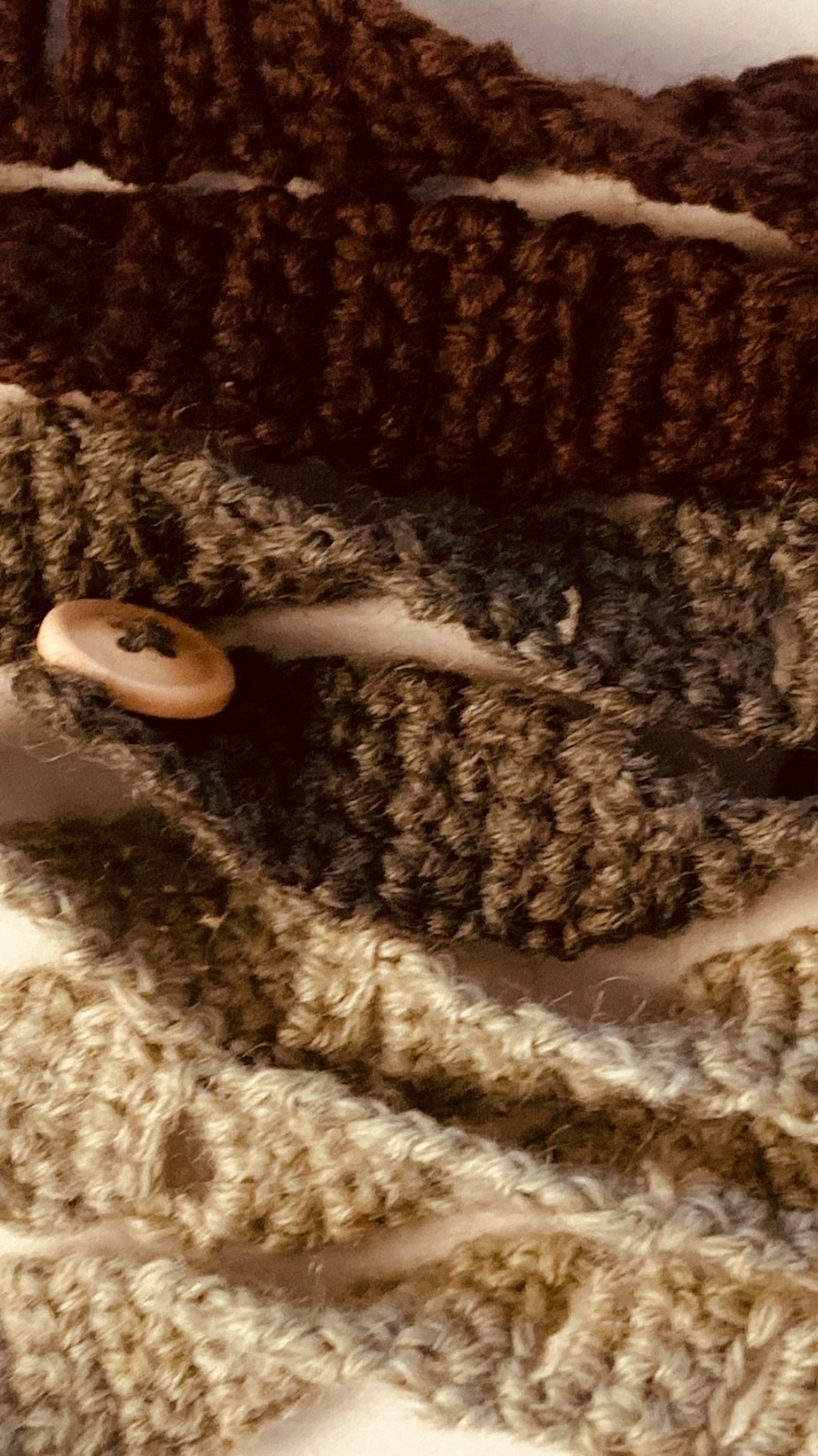 Image of overlapping knitted straps in various shades of brown and beige