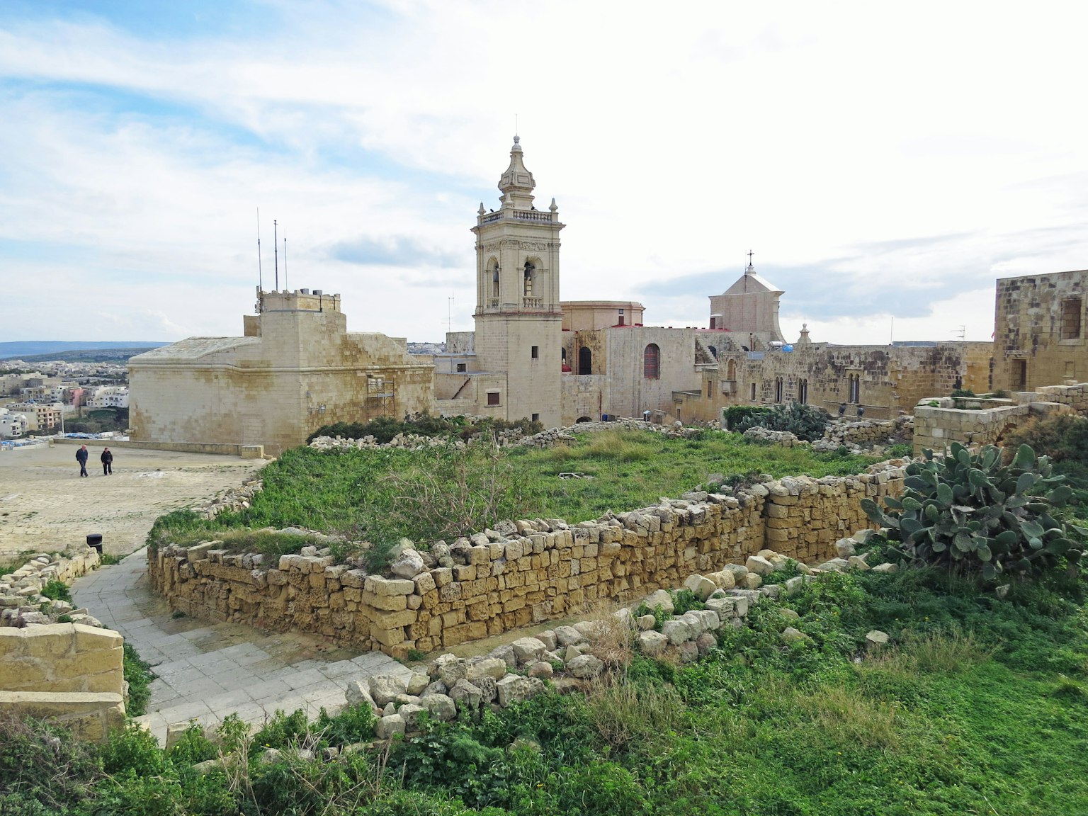 Historical buildings of Malta with lush greenery in the foreground