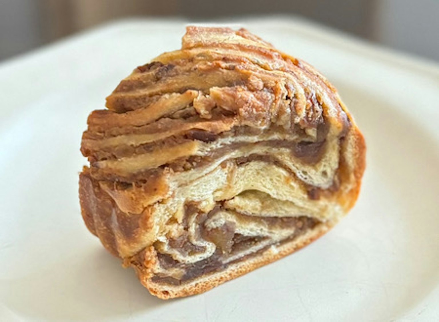 A beautifully layered pastry showcasing chocolate and cream stripes
