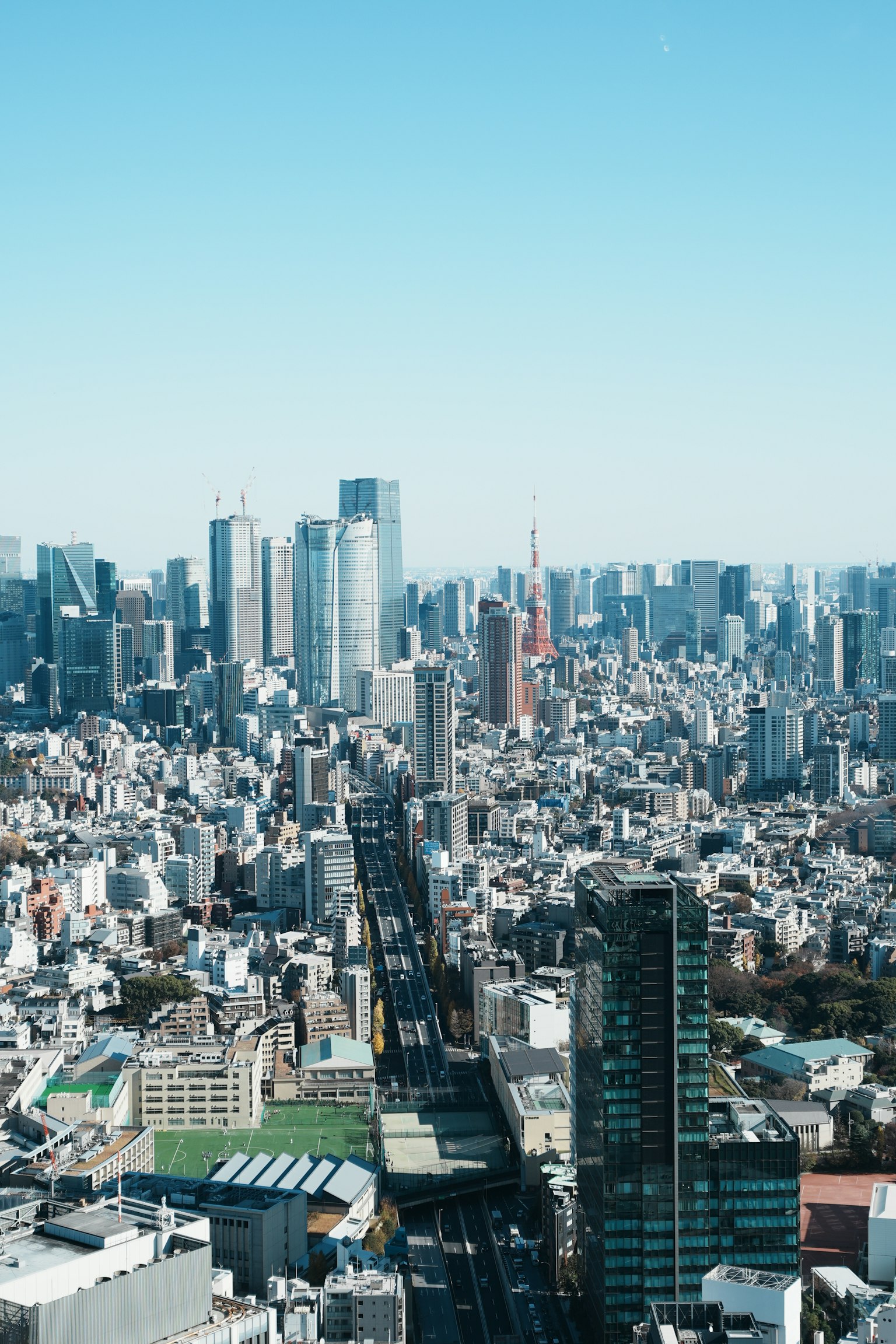A panoramic view of Tokyo's skyline featuring numerous skyscrapers