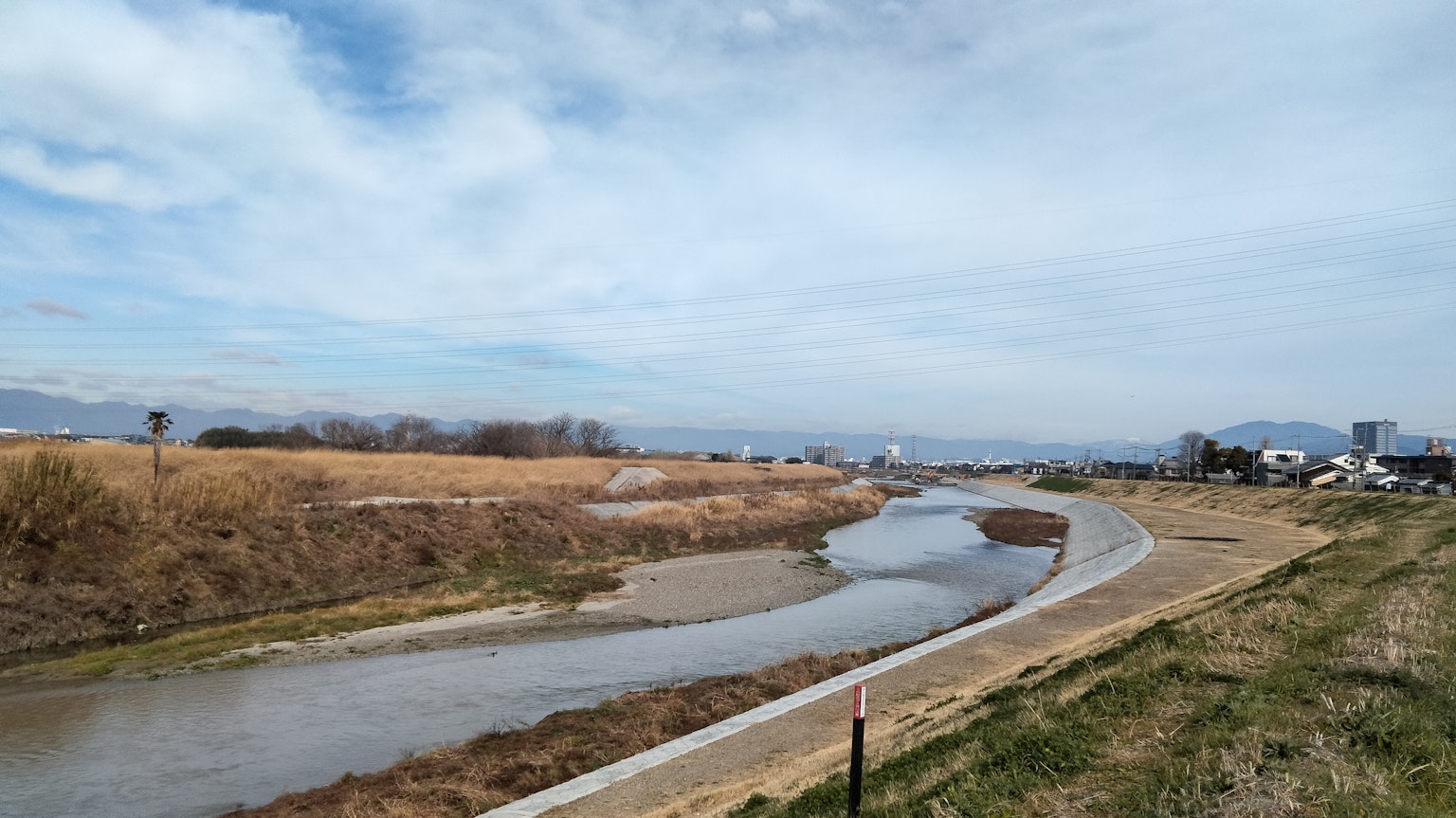 Serene river landscape with a blue sky