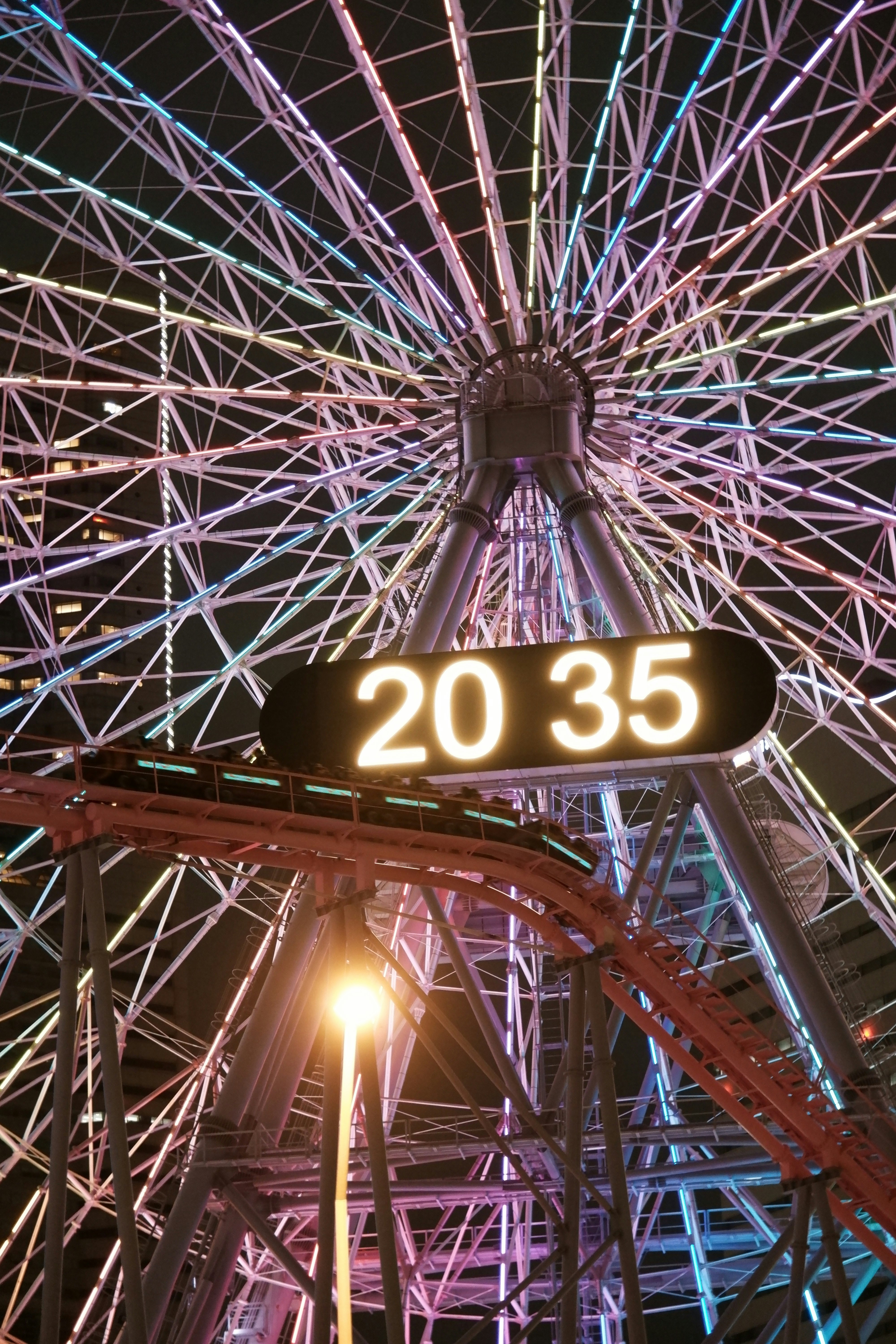 Giant steel arched dome structure with a “20 35” display in the viewing space