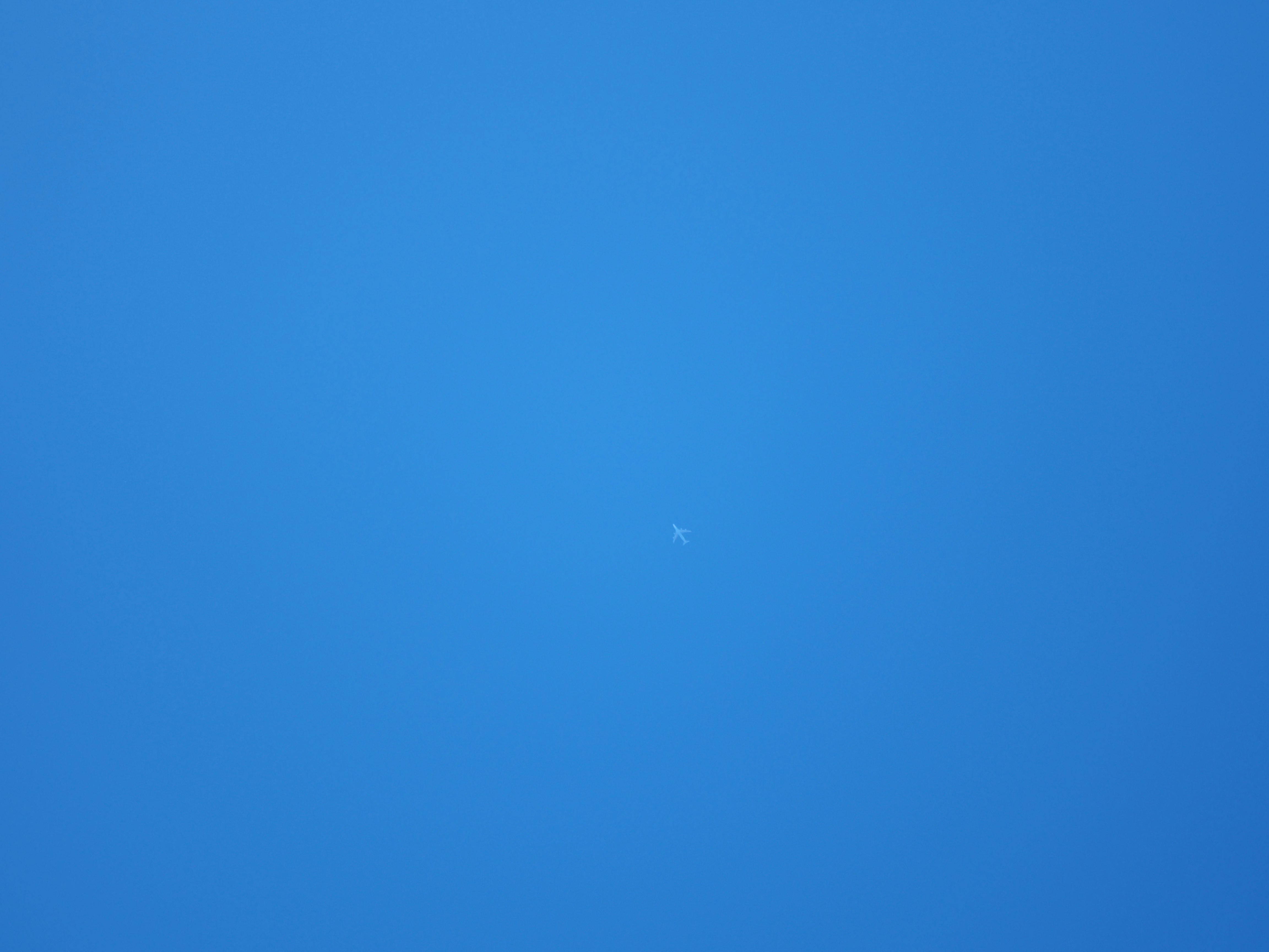 simple blue sky background with open expanse