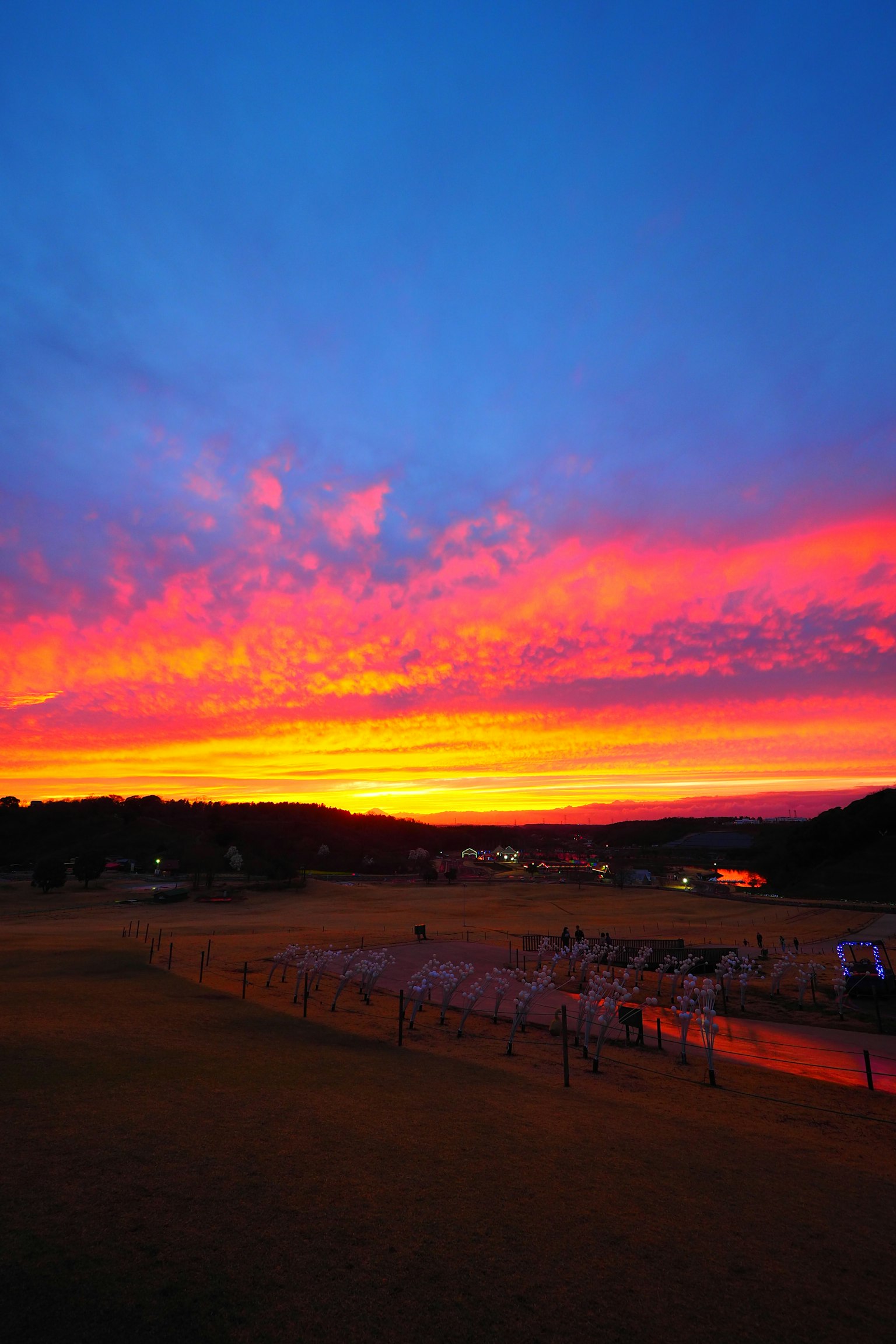 Vibrant sunset sky with silhouetted mountains