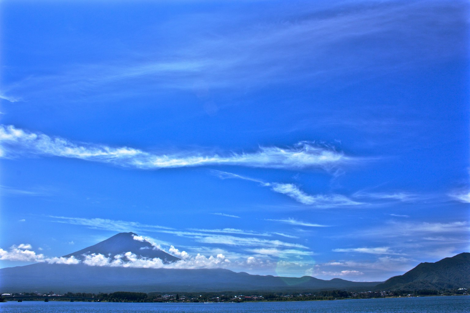 Beautiful mountain landscape surrounded by blue sky and white clouds
