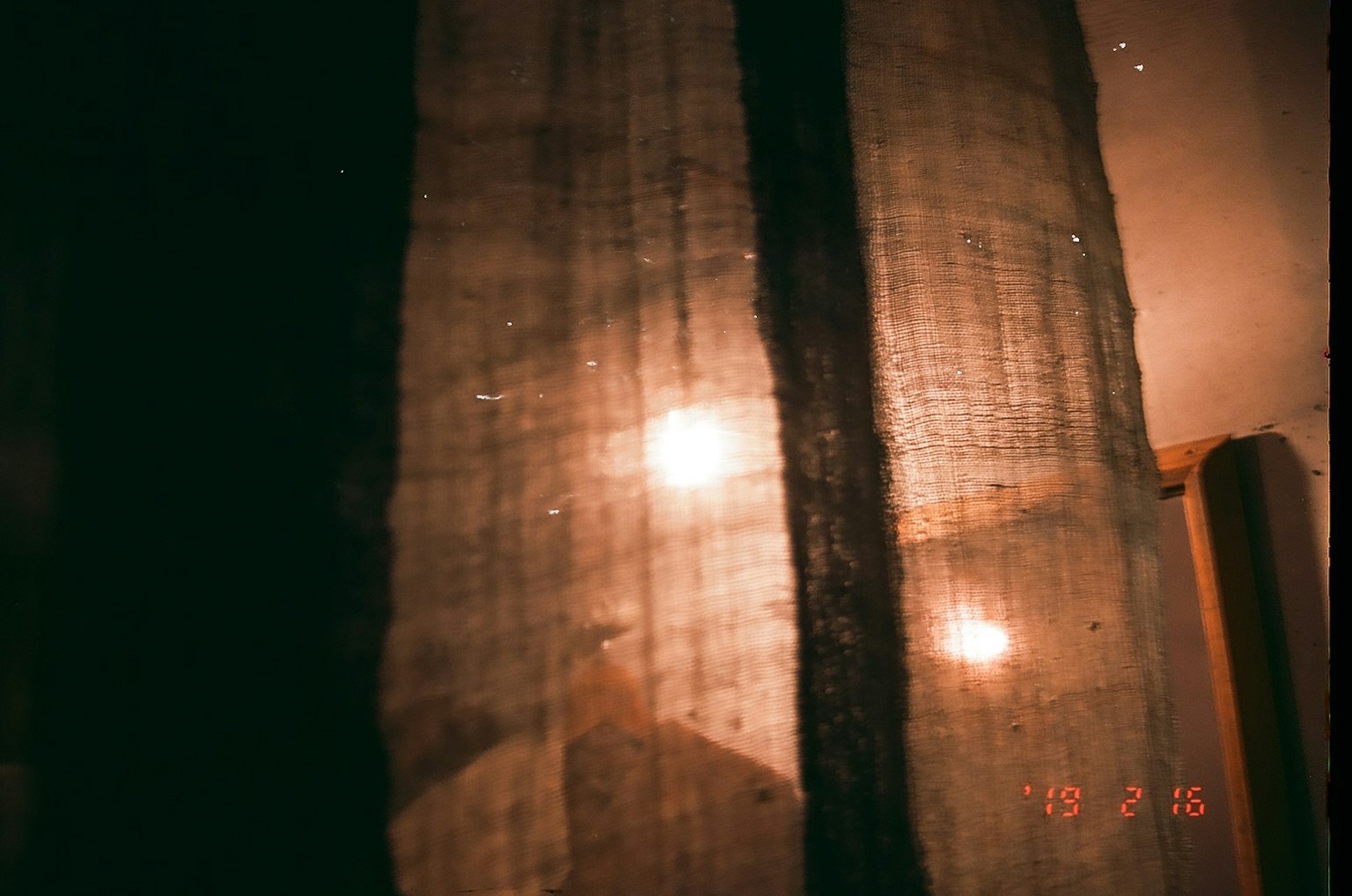 Soft light filtering through a sheer curtain
