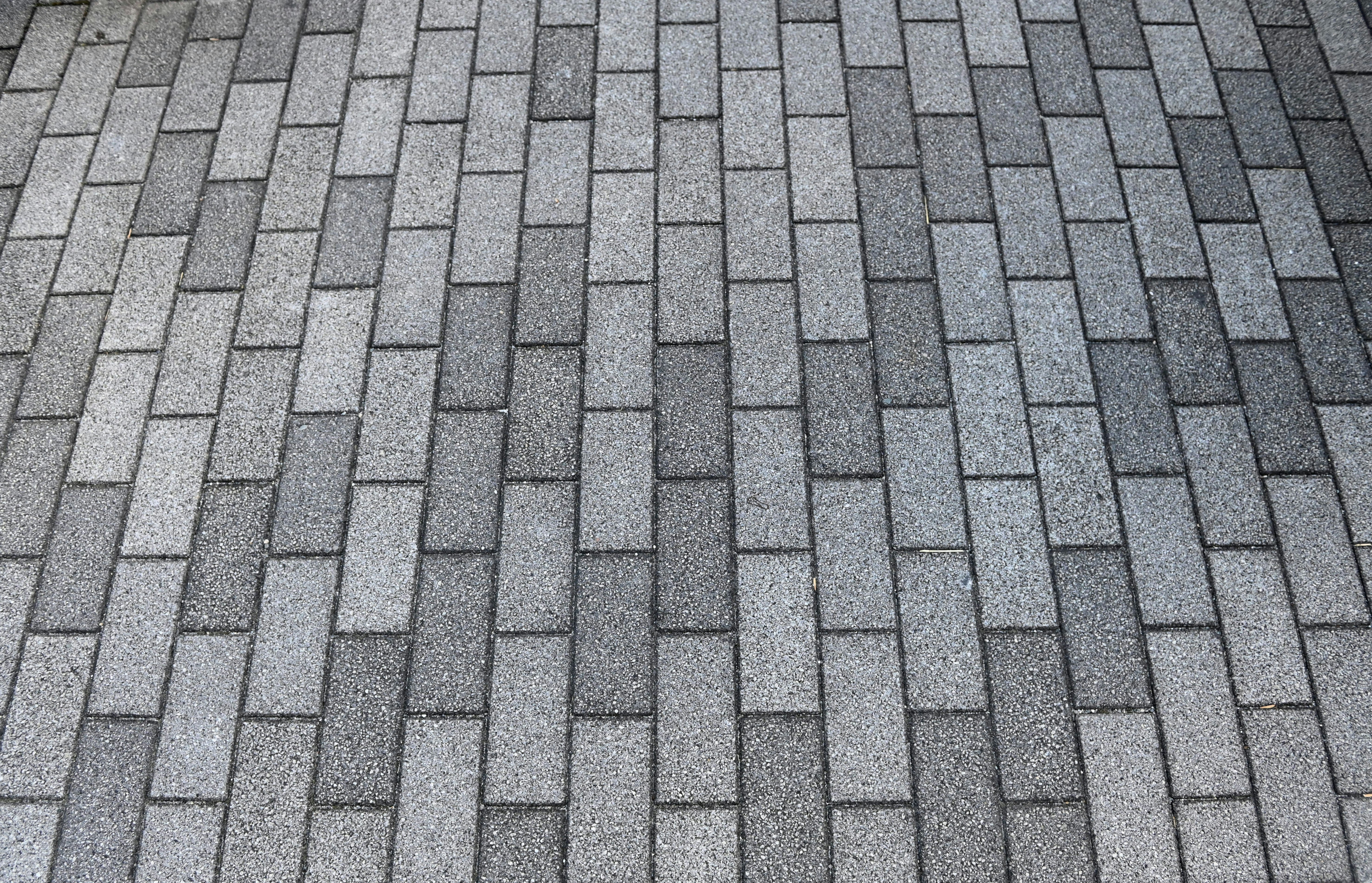 Gray tiles arranged in a neat pattern on pavement
