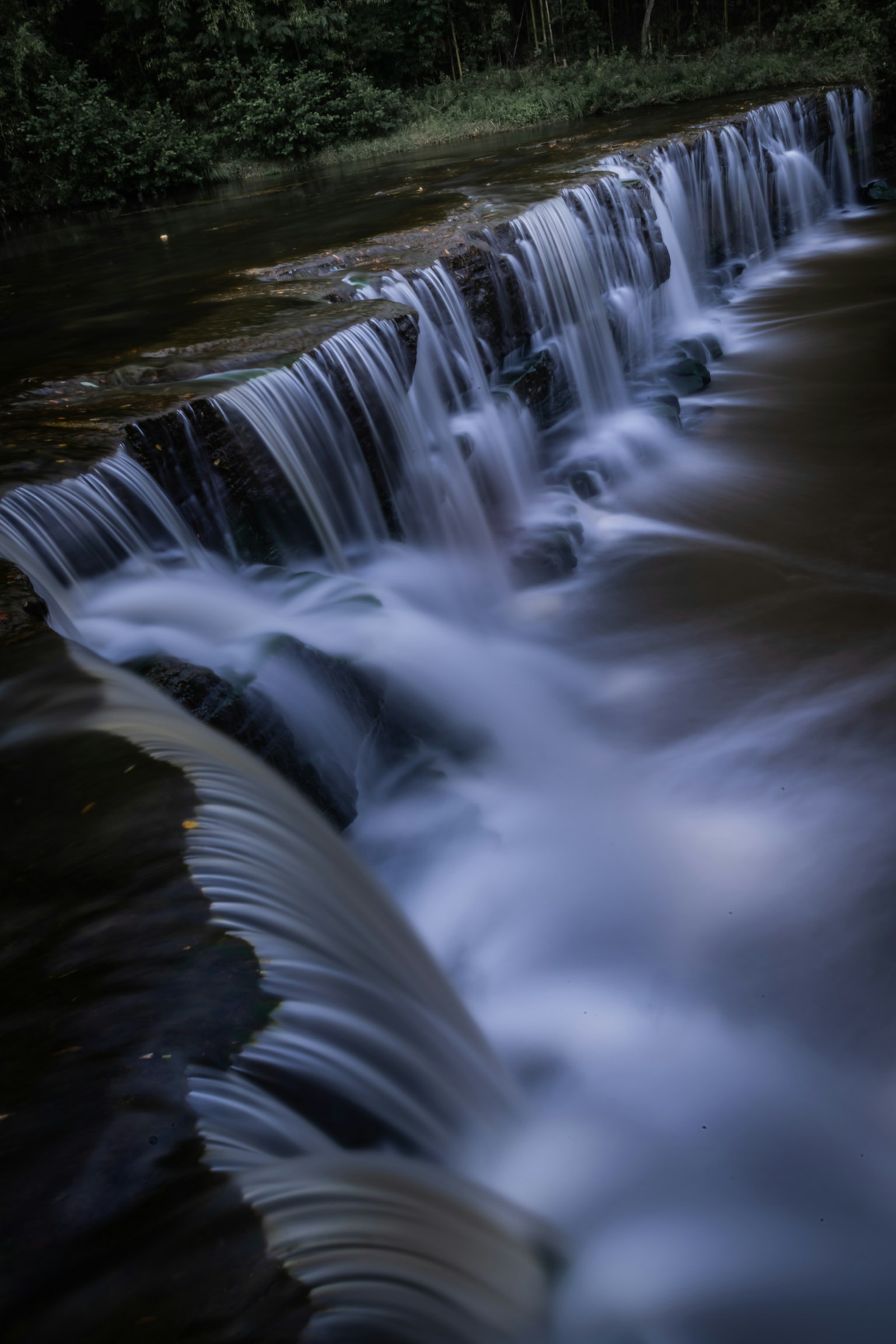 A beautiful landscape image capturing the flow of a waterfall