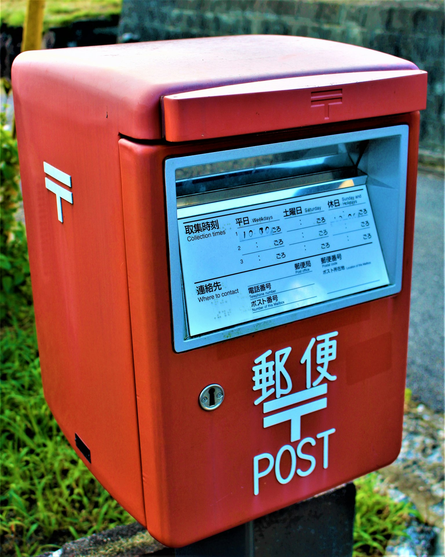 Red postal box with mail inserted