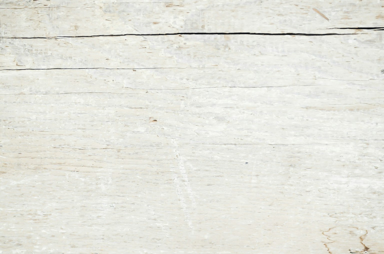 Superficie in legno bianco con piccole crepe