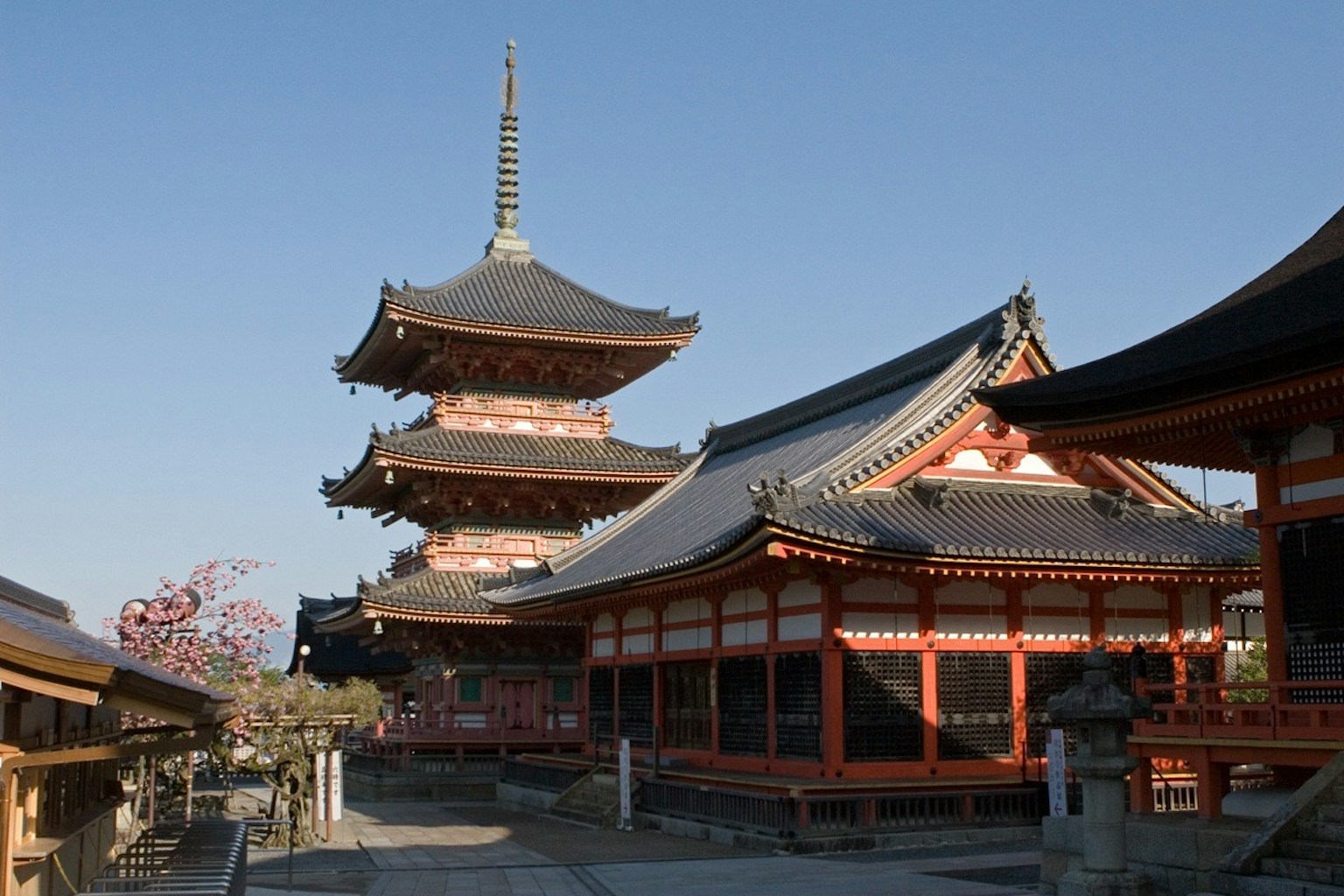 Kiyomizu-dera temple complex with beautiful buildings and pagoda under blue sky