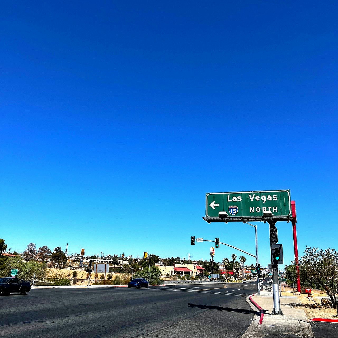 Las Vegas northbound road sign under a clear blue sky