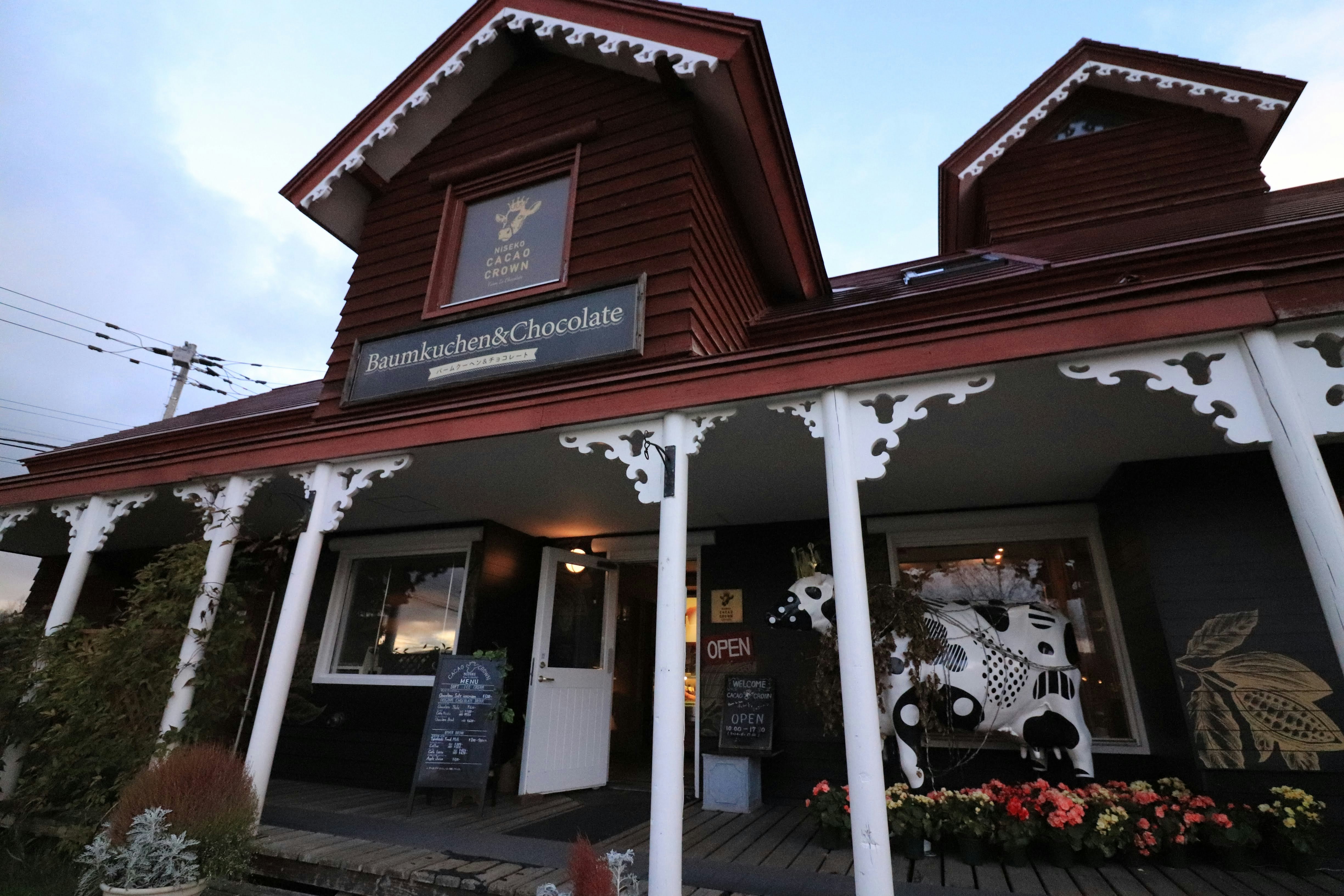 Wooden cafe exterior with signage and entrance