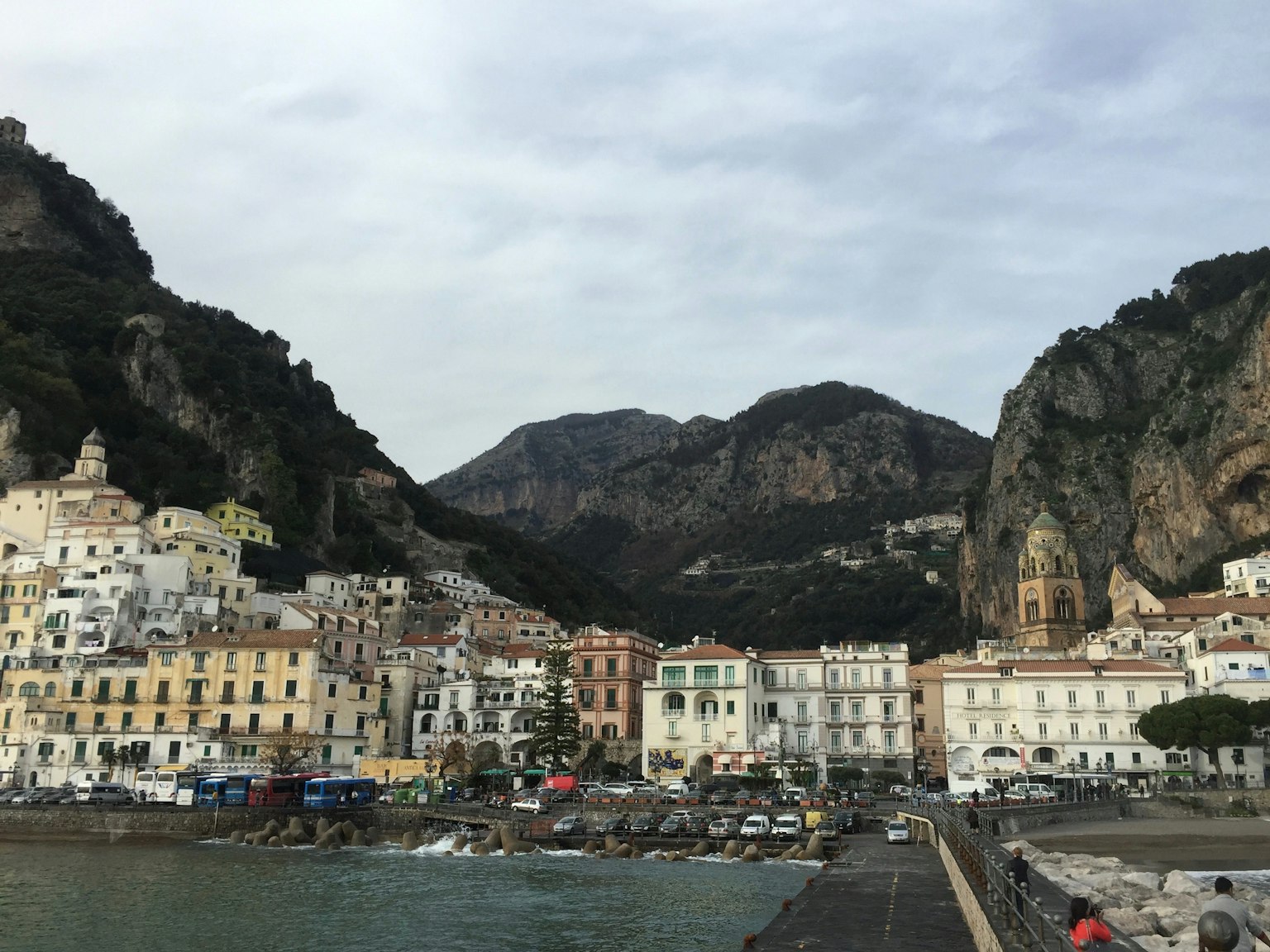 View of Amalfi's coastal town with mountains in the background