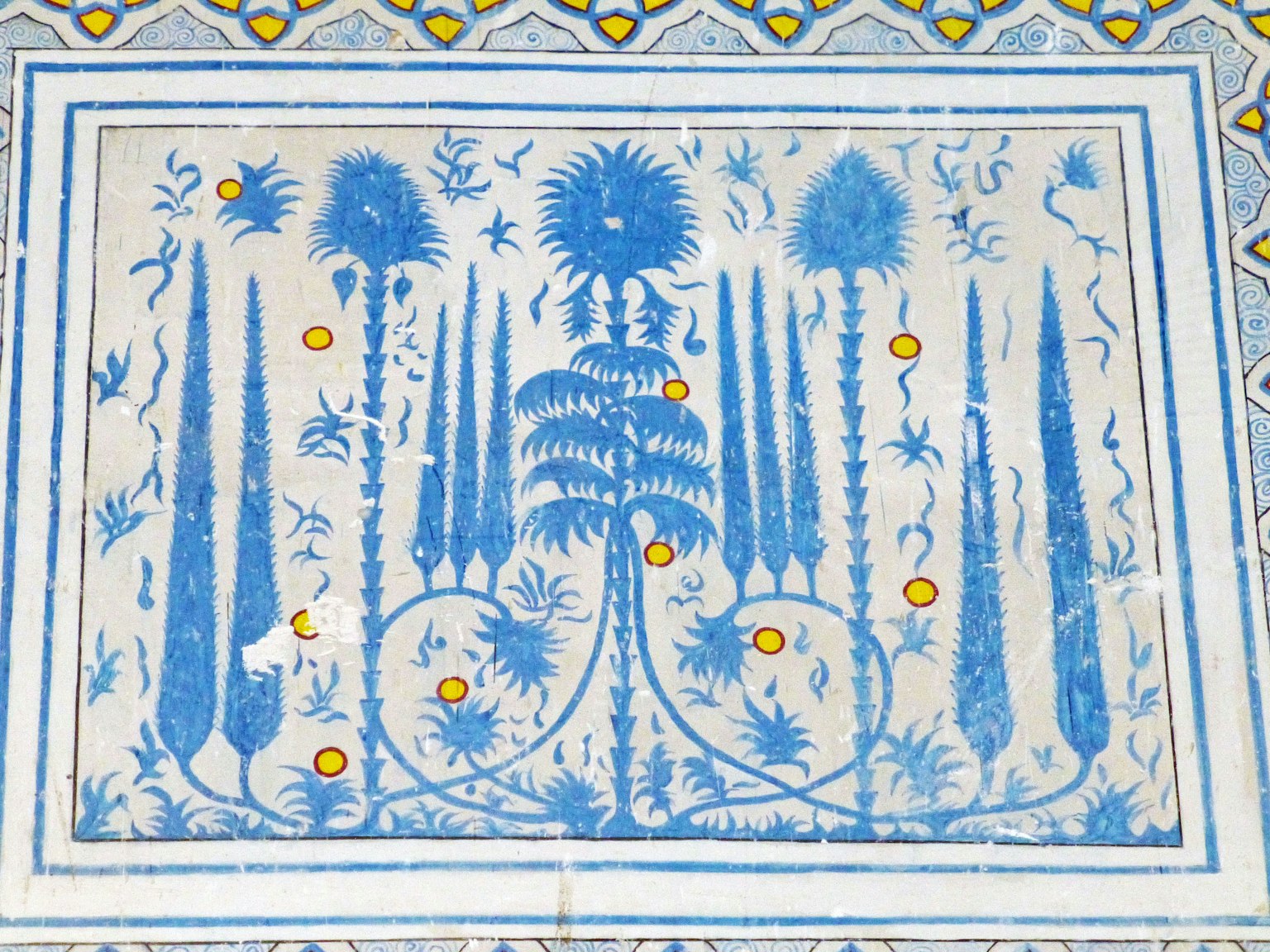 Decorative tile featuring blue botanical patterns