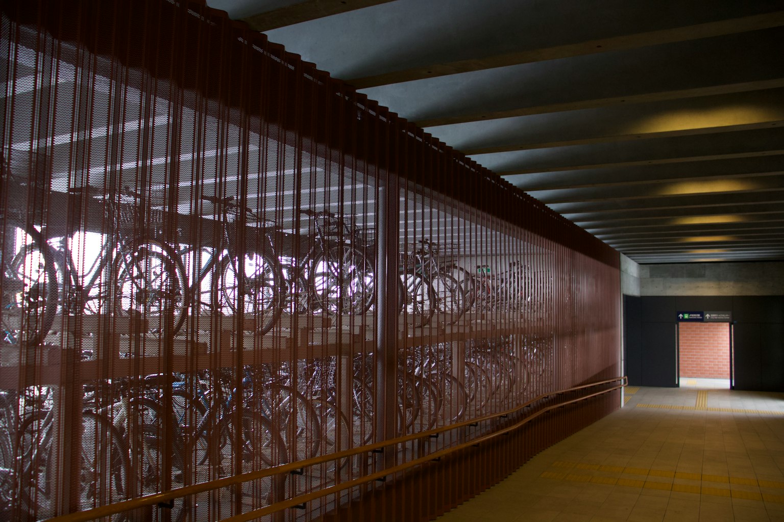 Interior of a modern hallway featuring a wall of bicycles