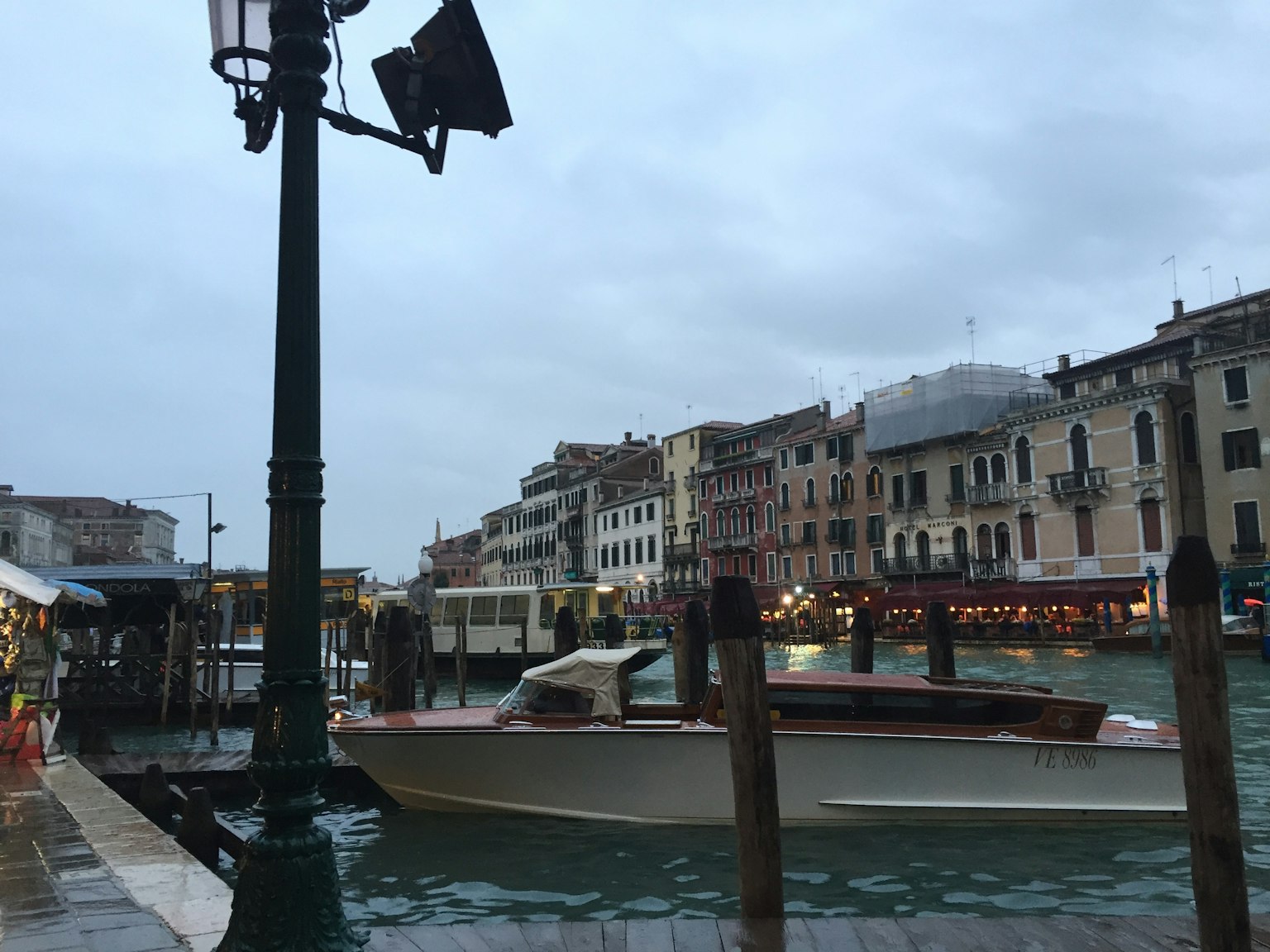 Venetian landscape with a boat on the water and historic buildings