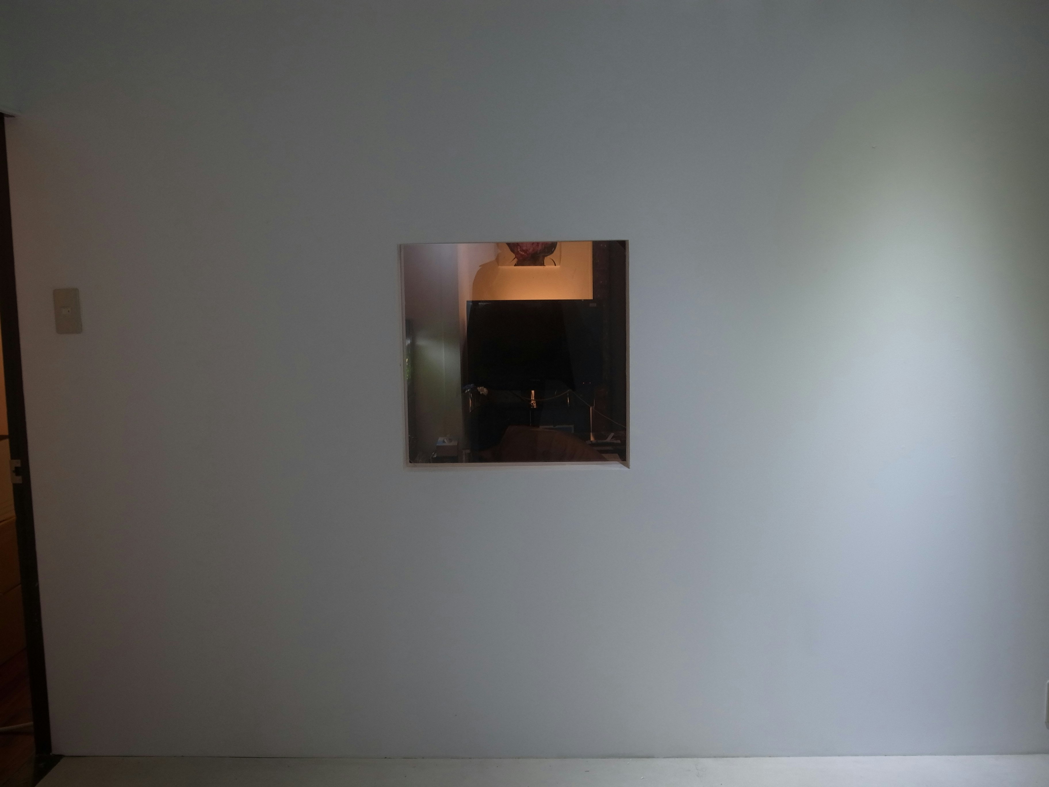 indoor wall with an abstract art panel