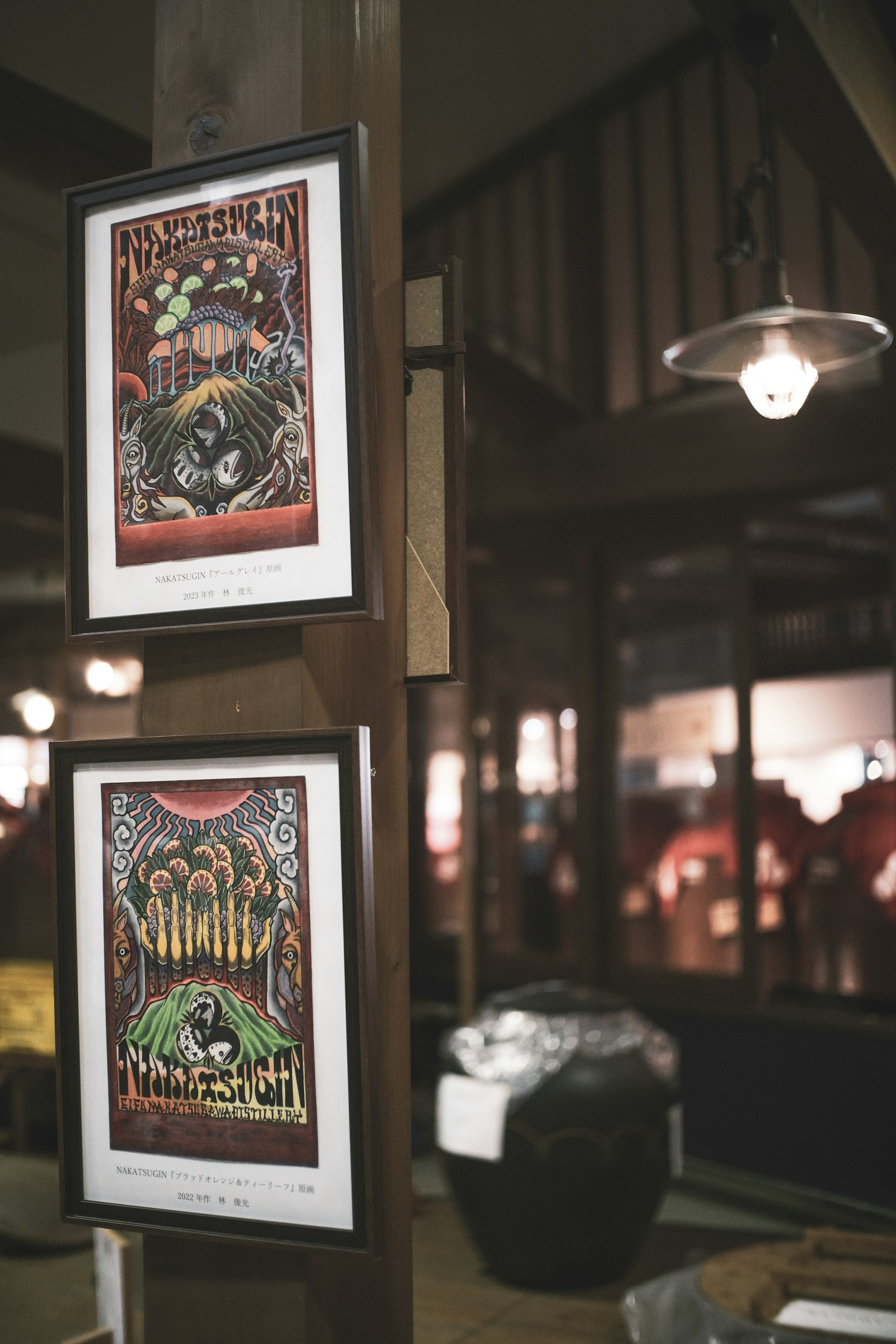 Indoor scene featuring framed art posters on a wall