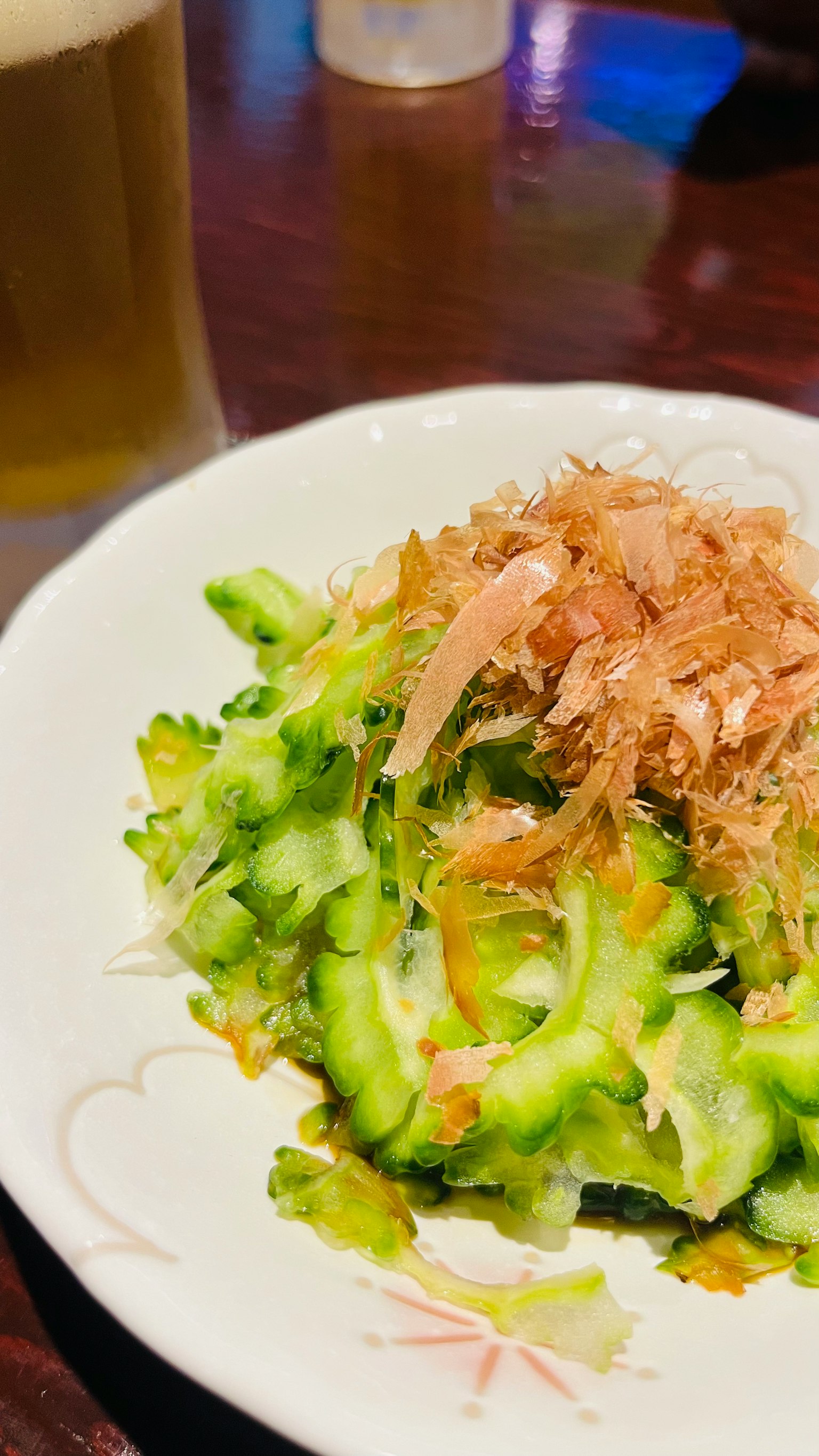 Bitter melon salad topped with bonito flakes