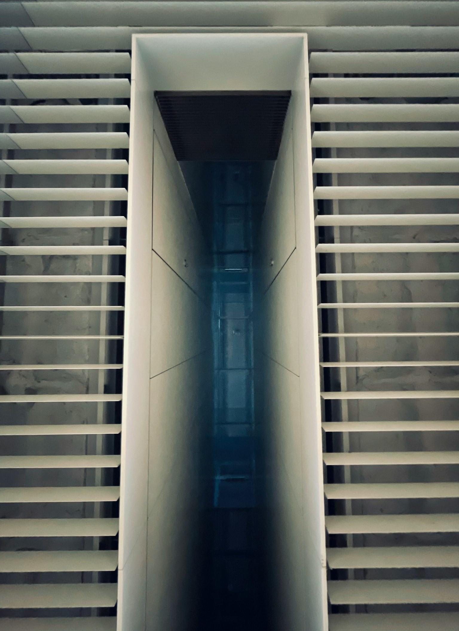 Modern architectural interior featuring sharp lines and structural elements