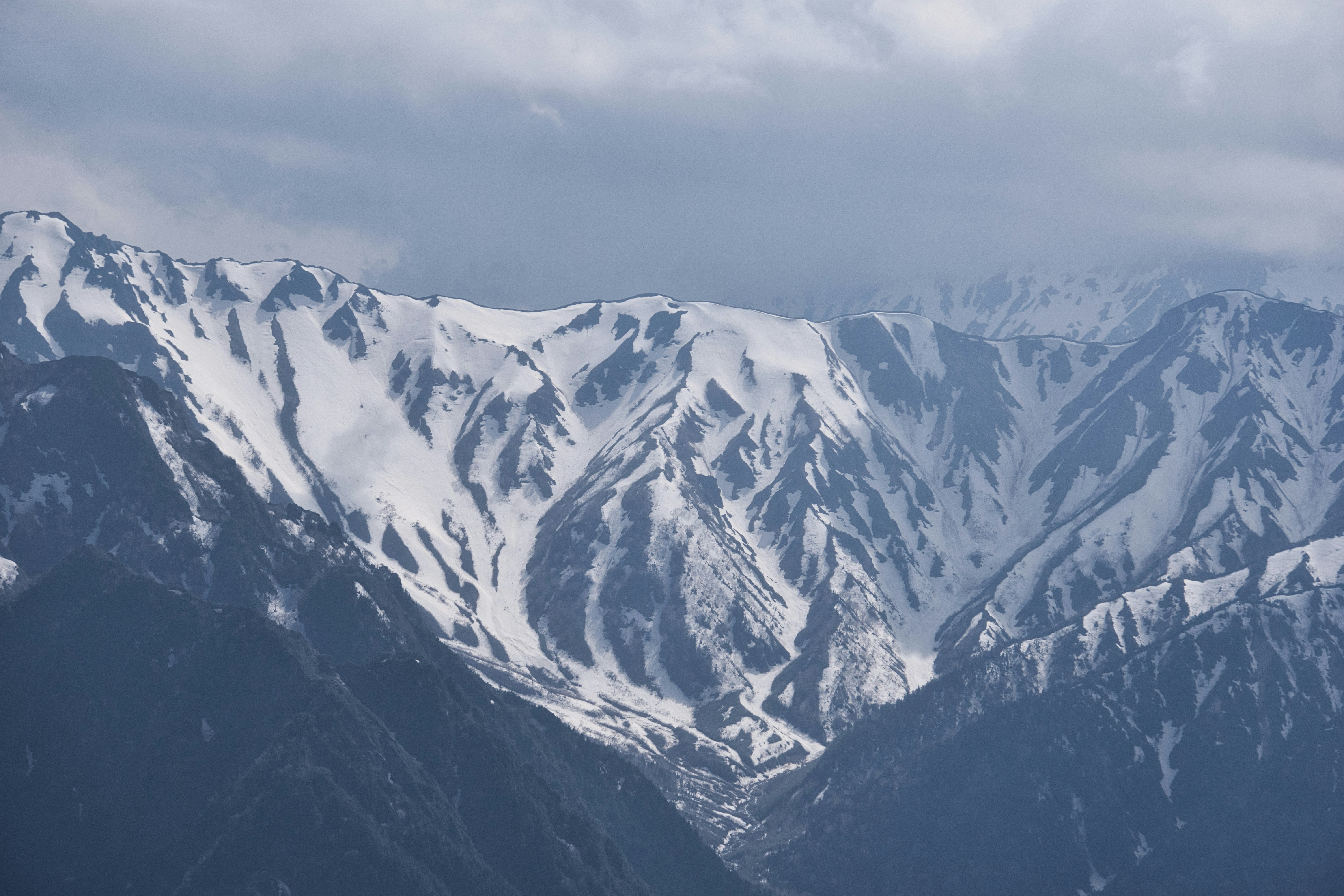 snow-capped mountain ridges and a valley view