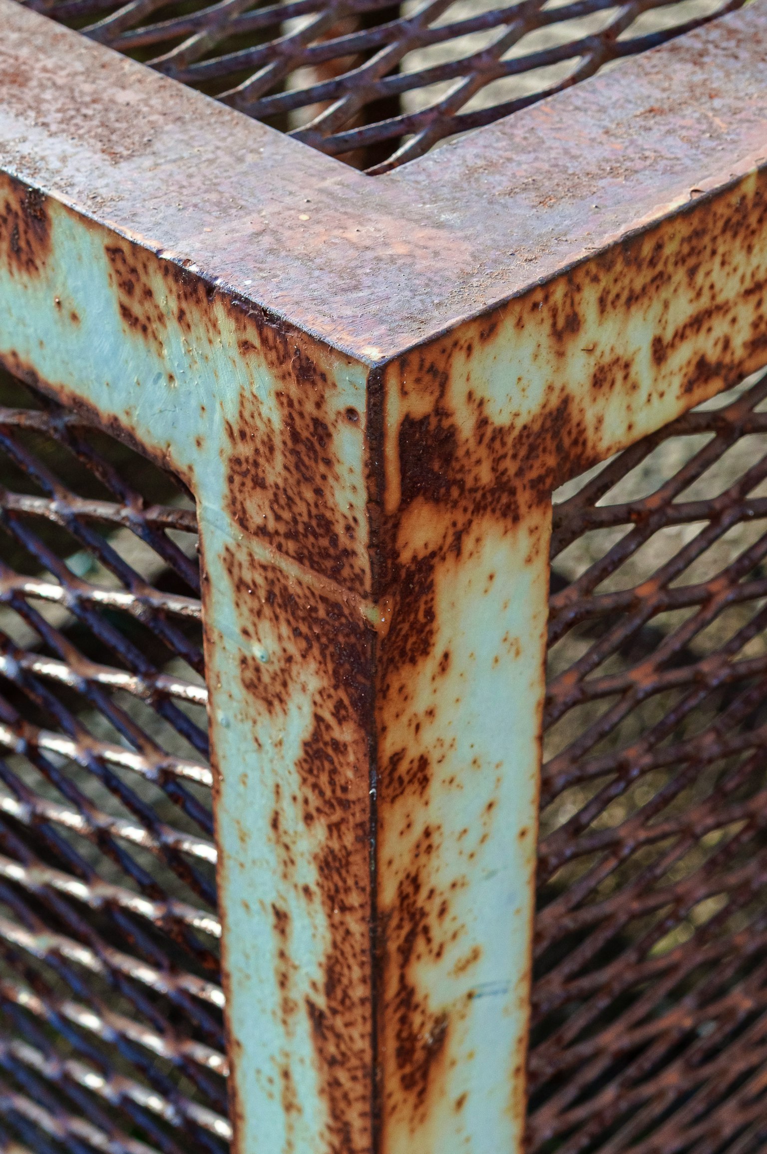 Rusty metal corner with mesh structure details