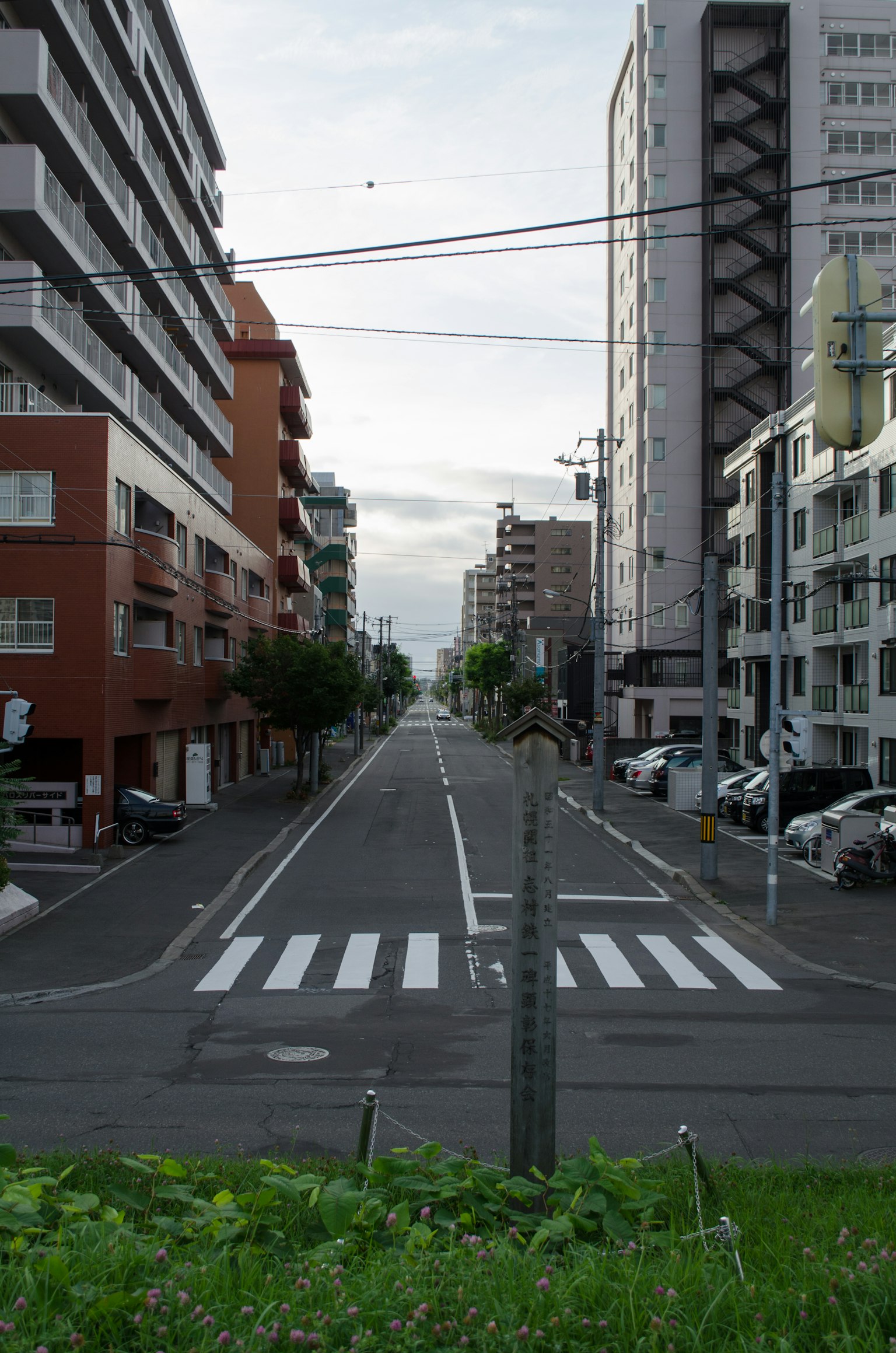 Urban street view featuring buildings and crosswalk