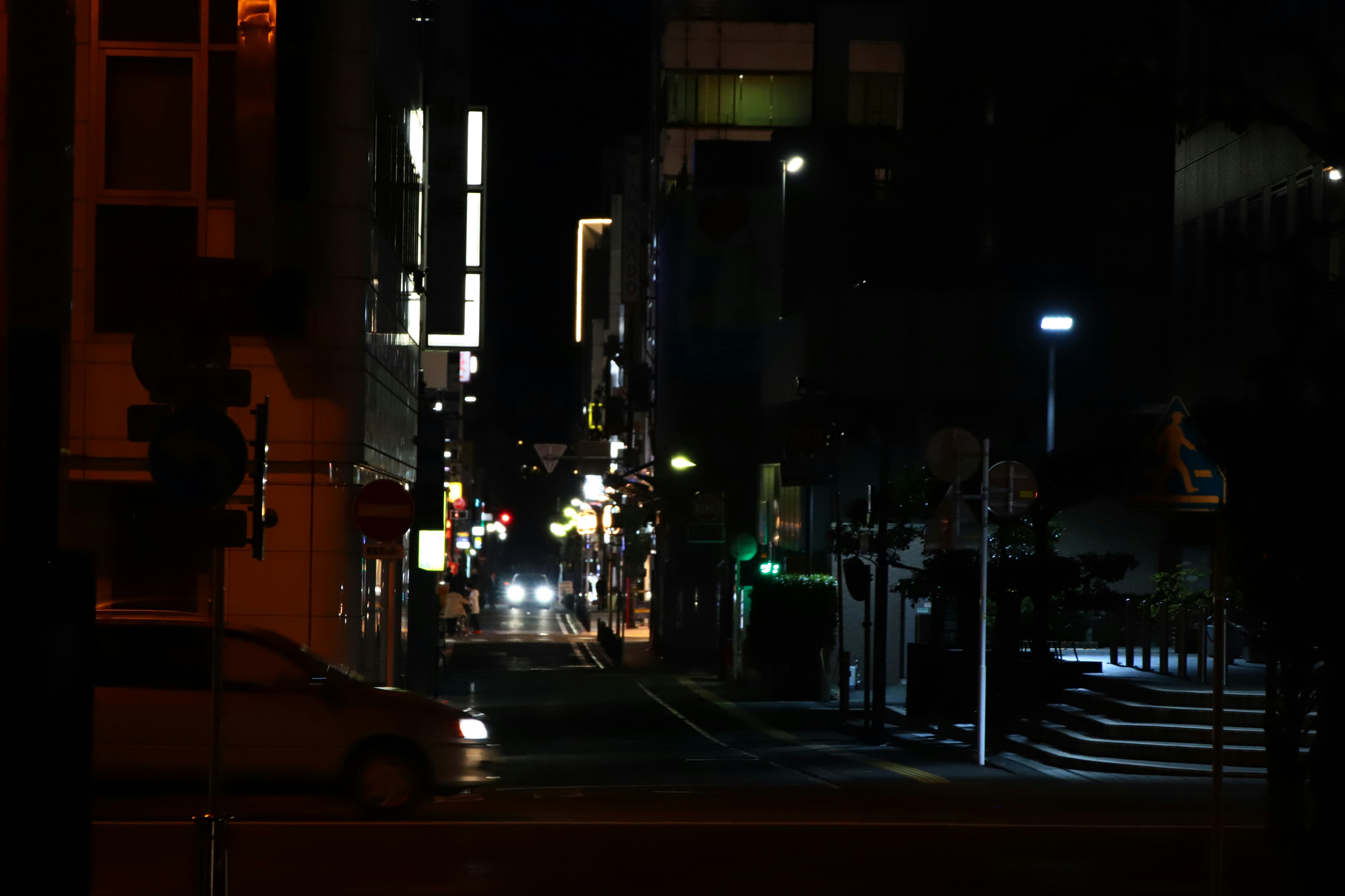 night alley street with streetlights and buildings