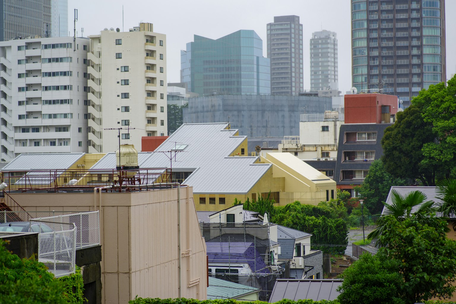 Urban landscape featuring modern skyscrapers and greenery in Tokyo