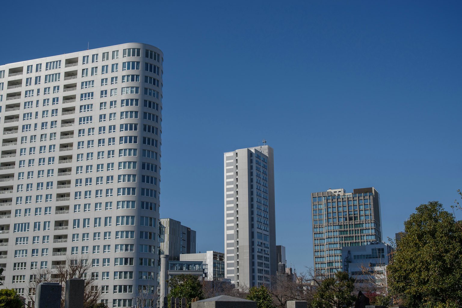 Photo of skyscrapers under a blue sky