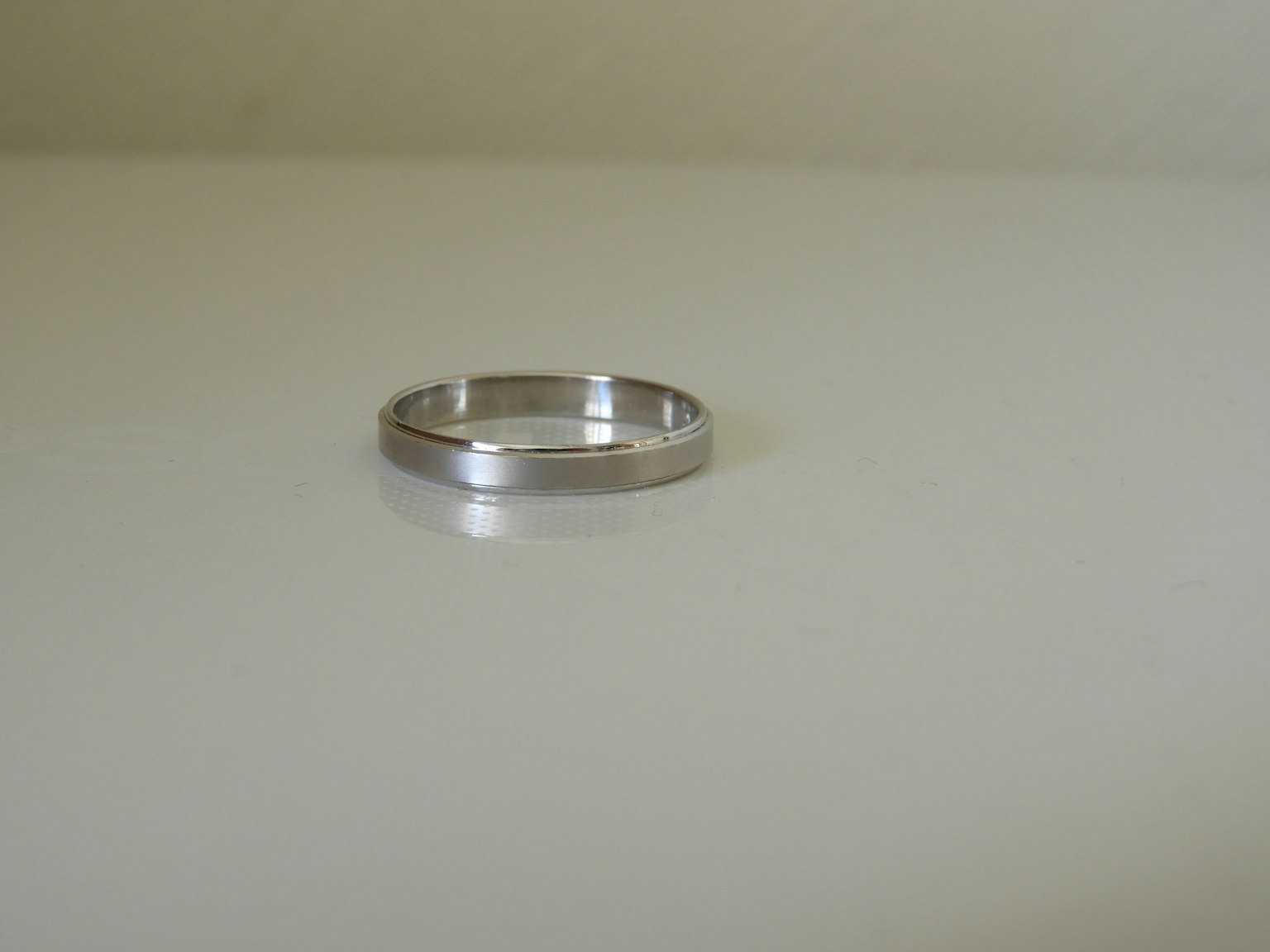 Silver ring placed on a white background