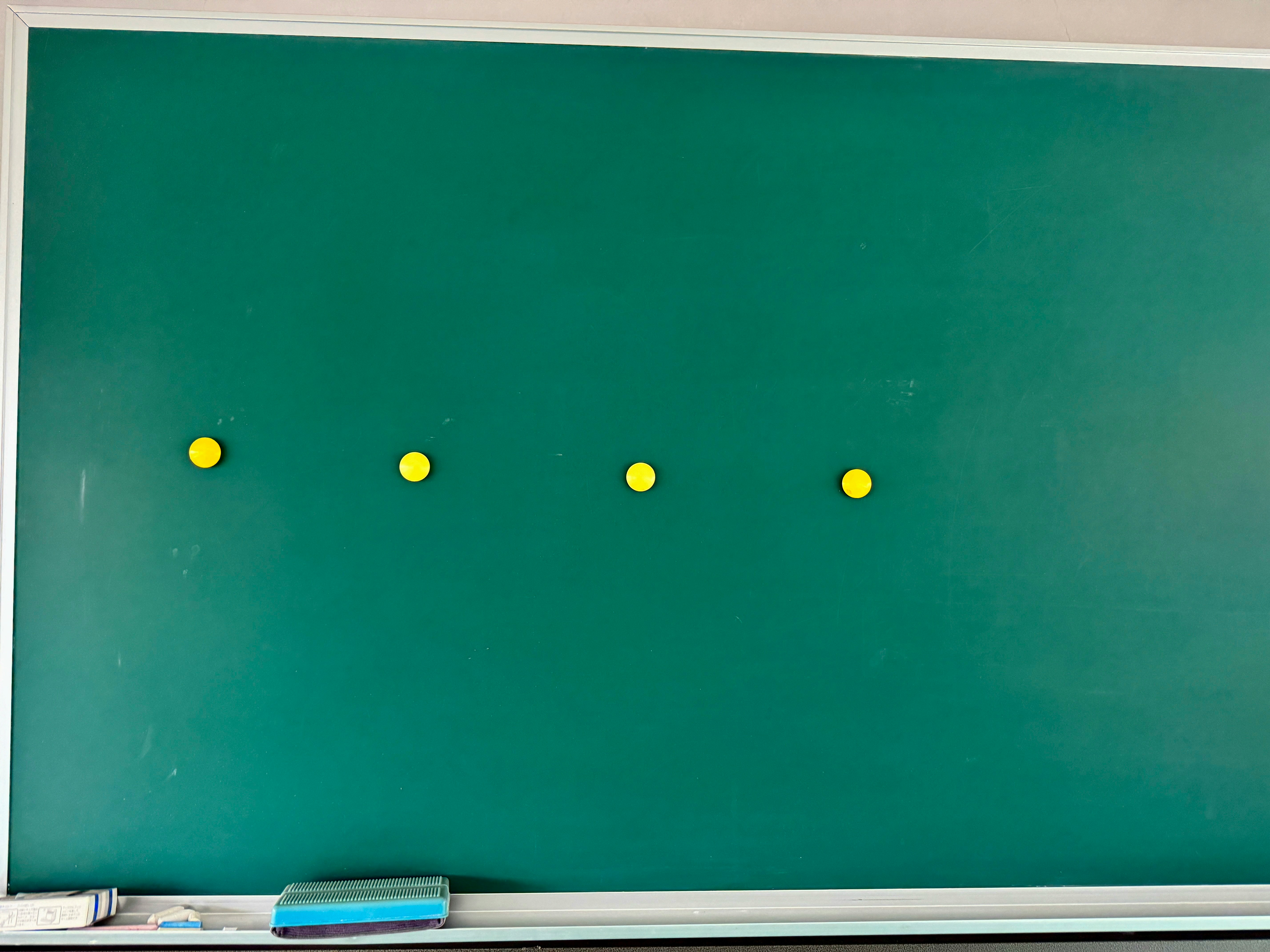 yellow dots on a green chalkboard