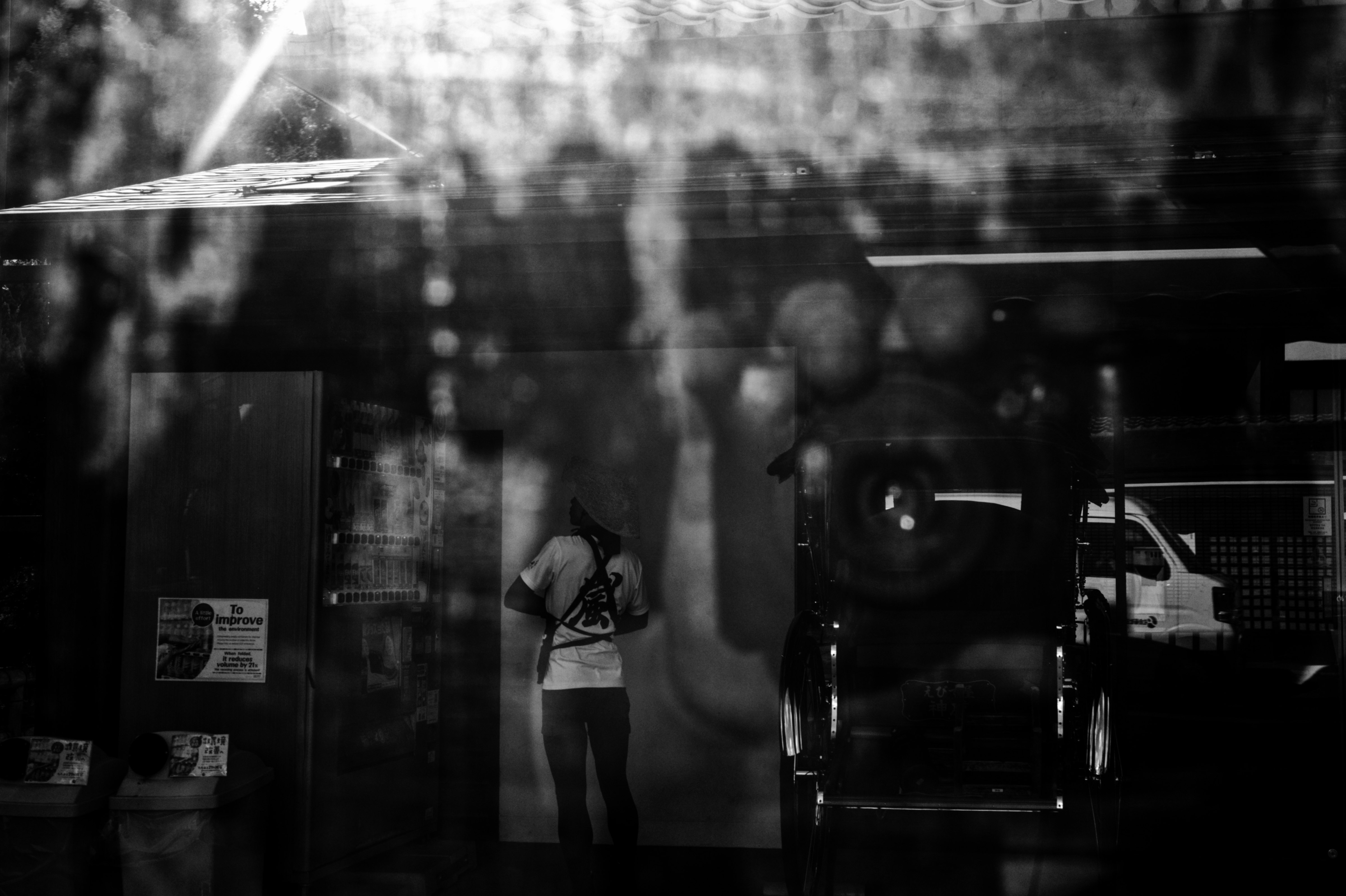 monochrome reflections of people and city atmosphere on glass
