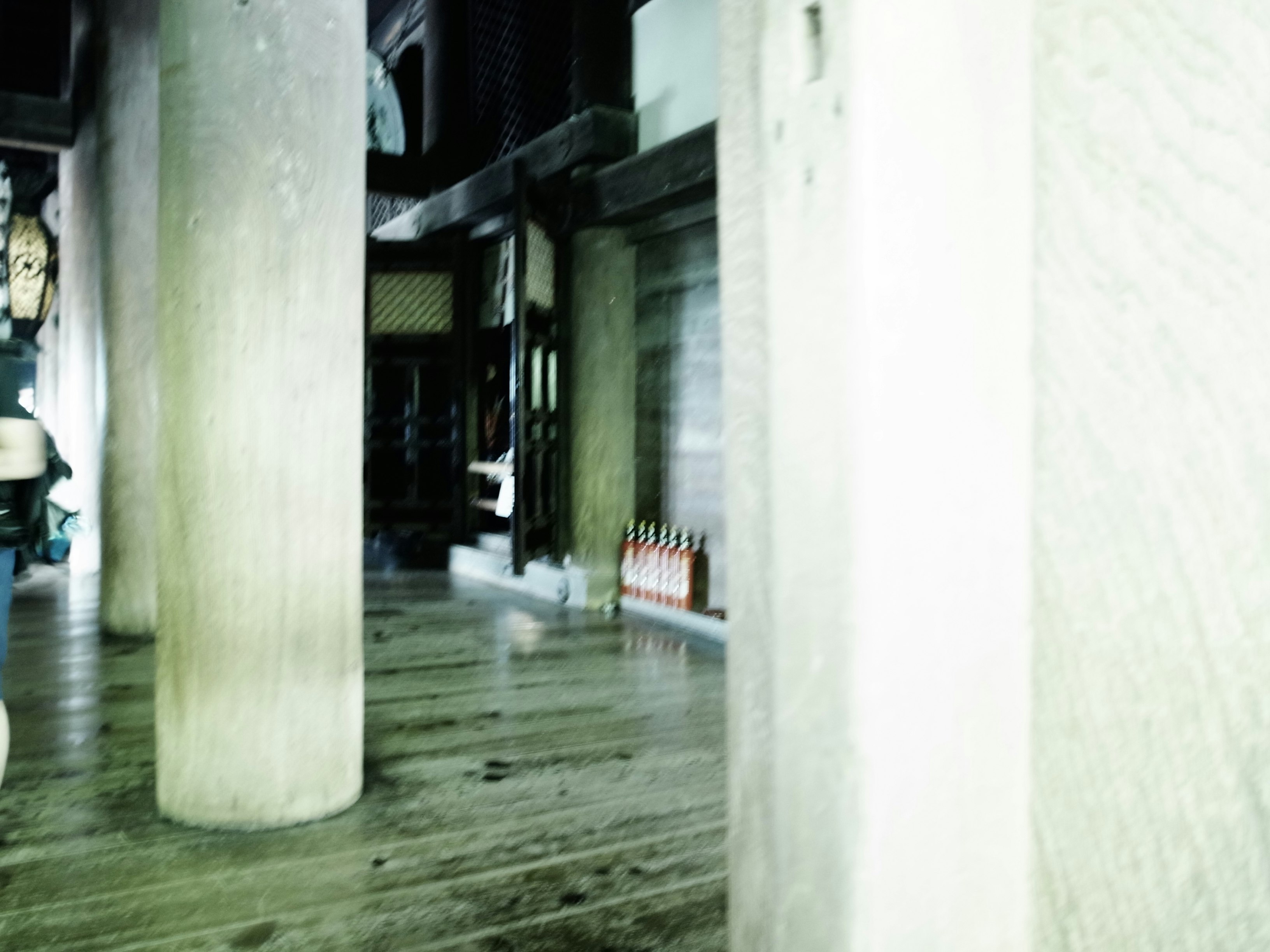 dim interior corridor with columns and deep perspective